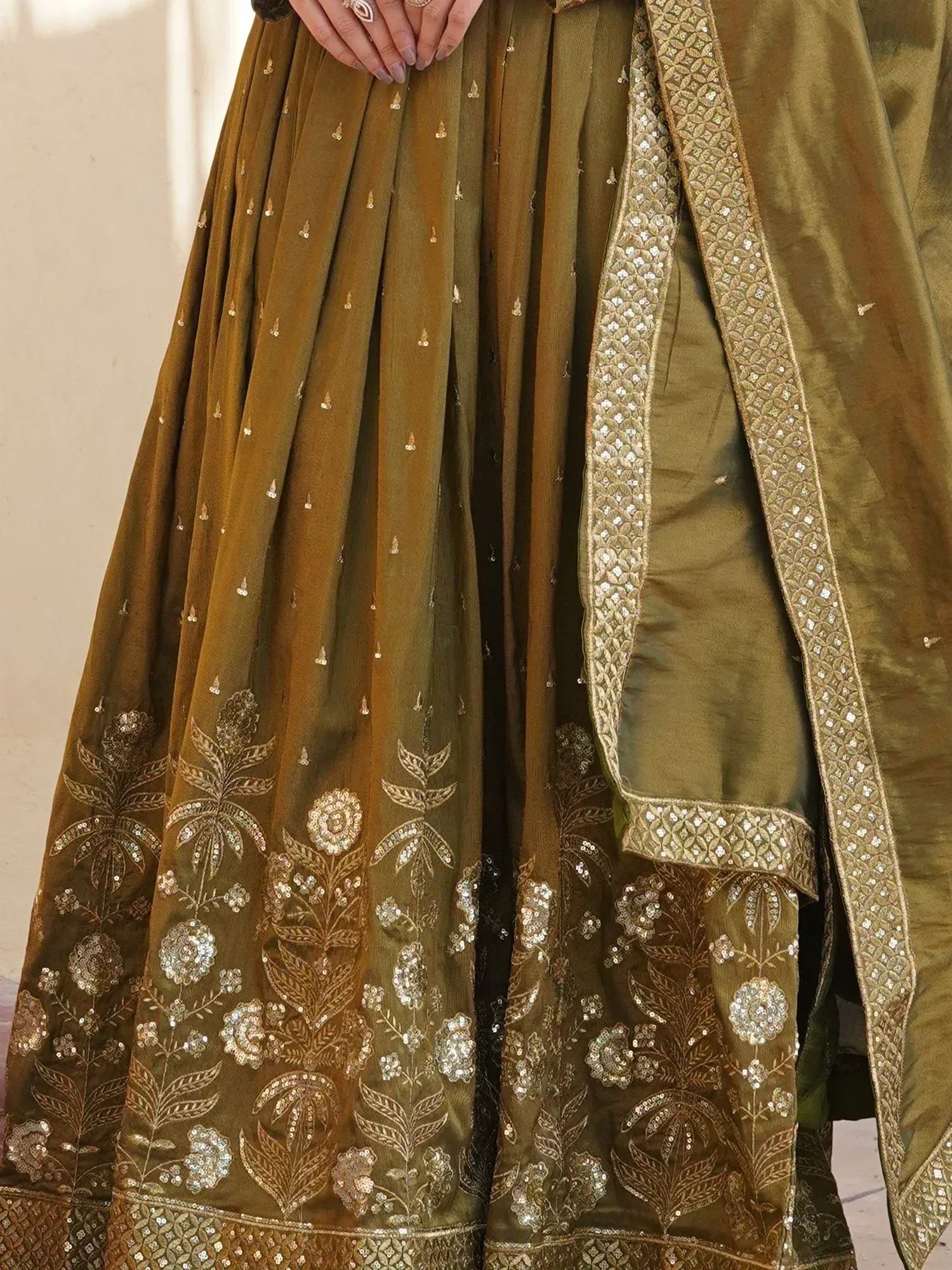 Olive green lehenga choli with gold floral embroidery and sequin detailing, perfect for Indian ethnic wear.