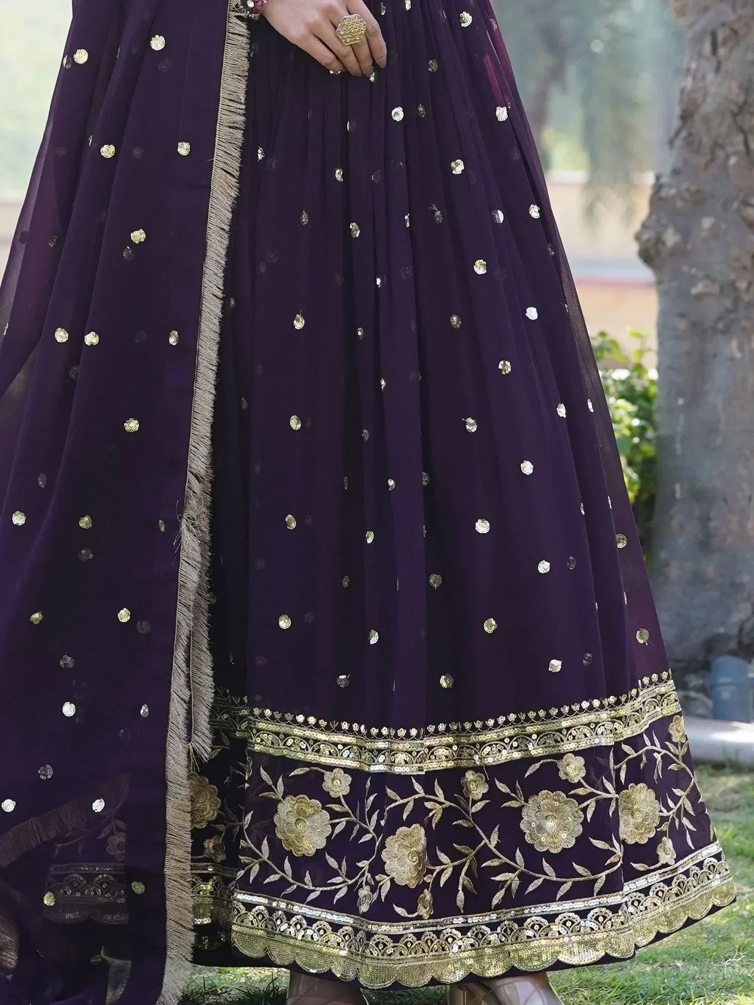 Purple ethnic lehenga with gold floral embroidery and sequin detailing, perfect for Indian weddings and festivals.