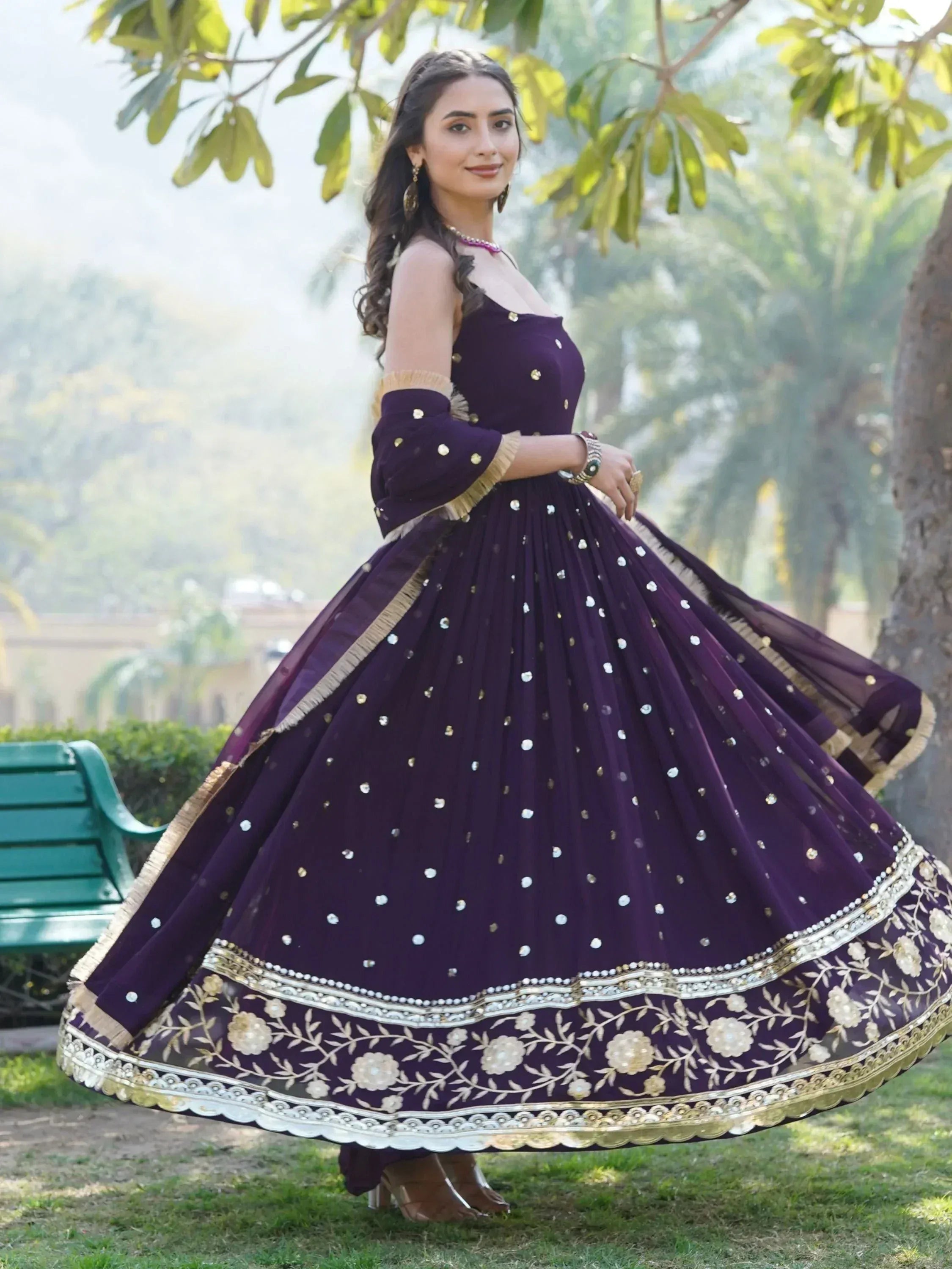 Elegant purple designer lehenga choli with gold embroidery, perfect for Indian ethnic wear occasions.