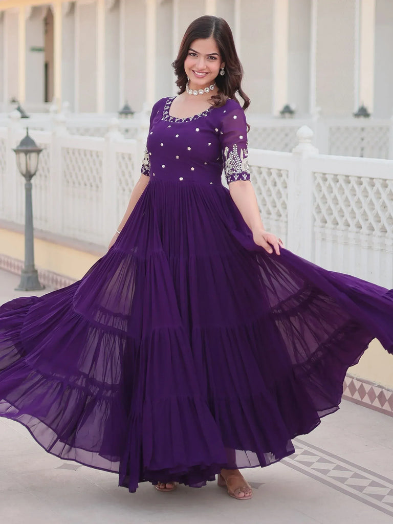 Purple ethnic gown with embroidery and tiered skirt, perfect for Indian occasions