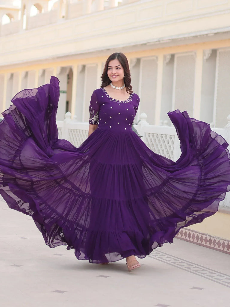 Purple ethnic gown with flared skirt and embroidery, perfect for Indian occasions