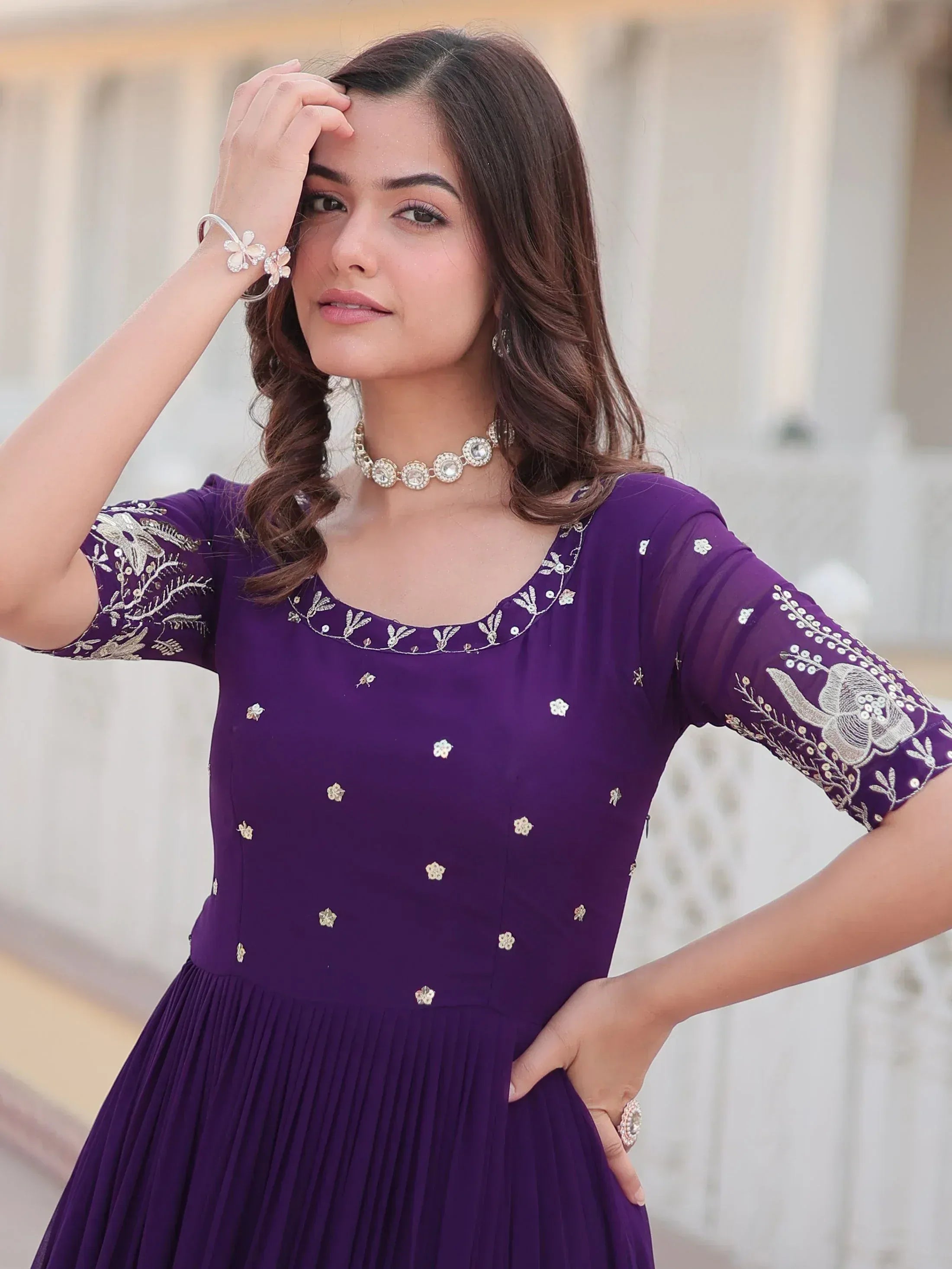 Purple embroidered ethnic gown with gold floral detailing, perfect for Indian occasions