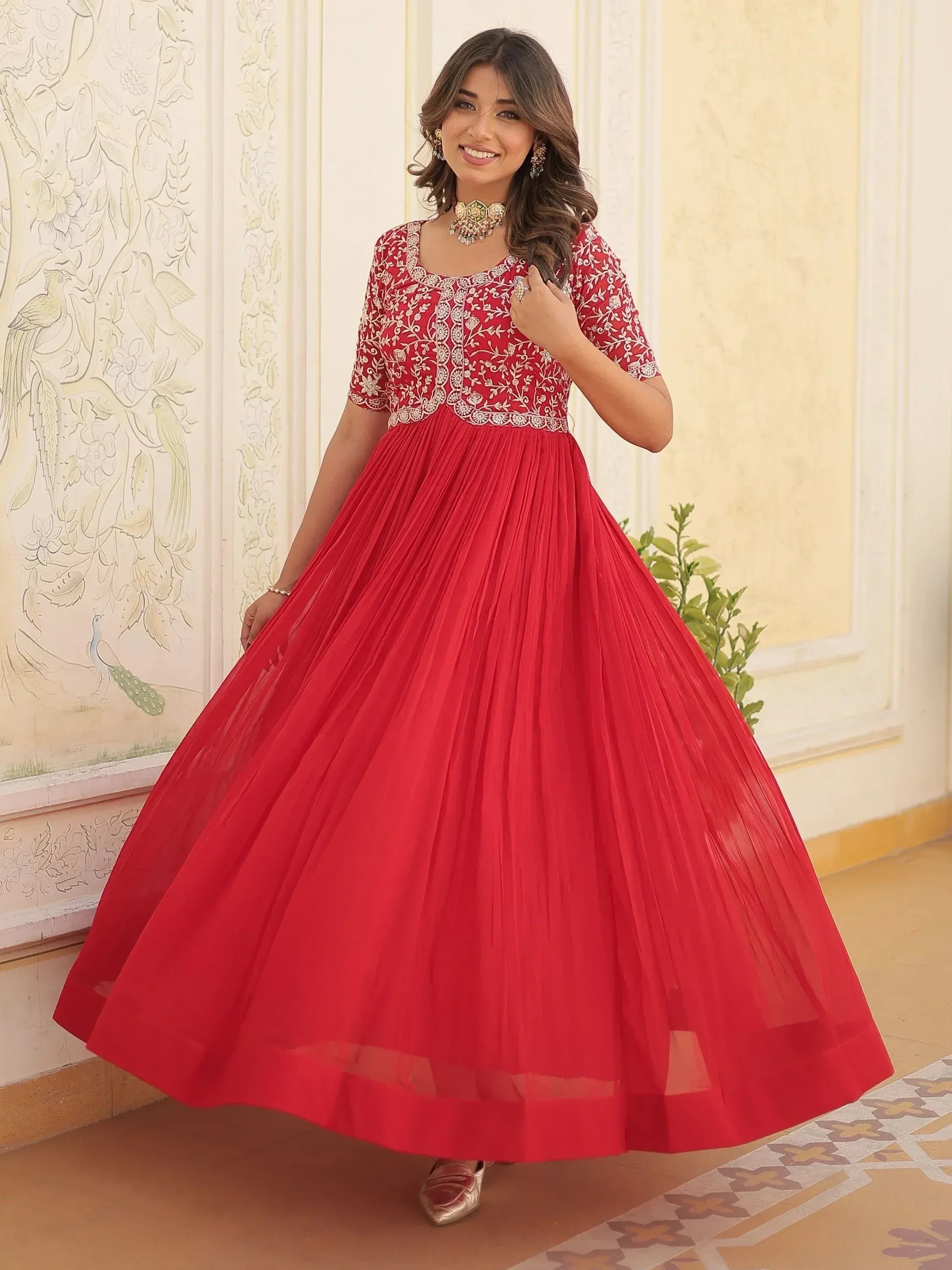 Red embroidered ethnic gown with pleated skirt, perfect for Indian festive occasions