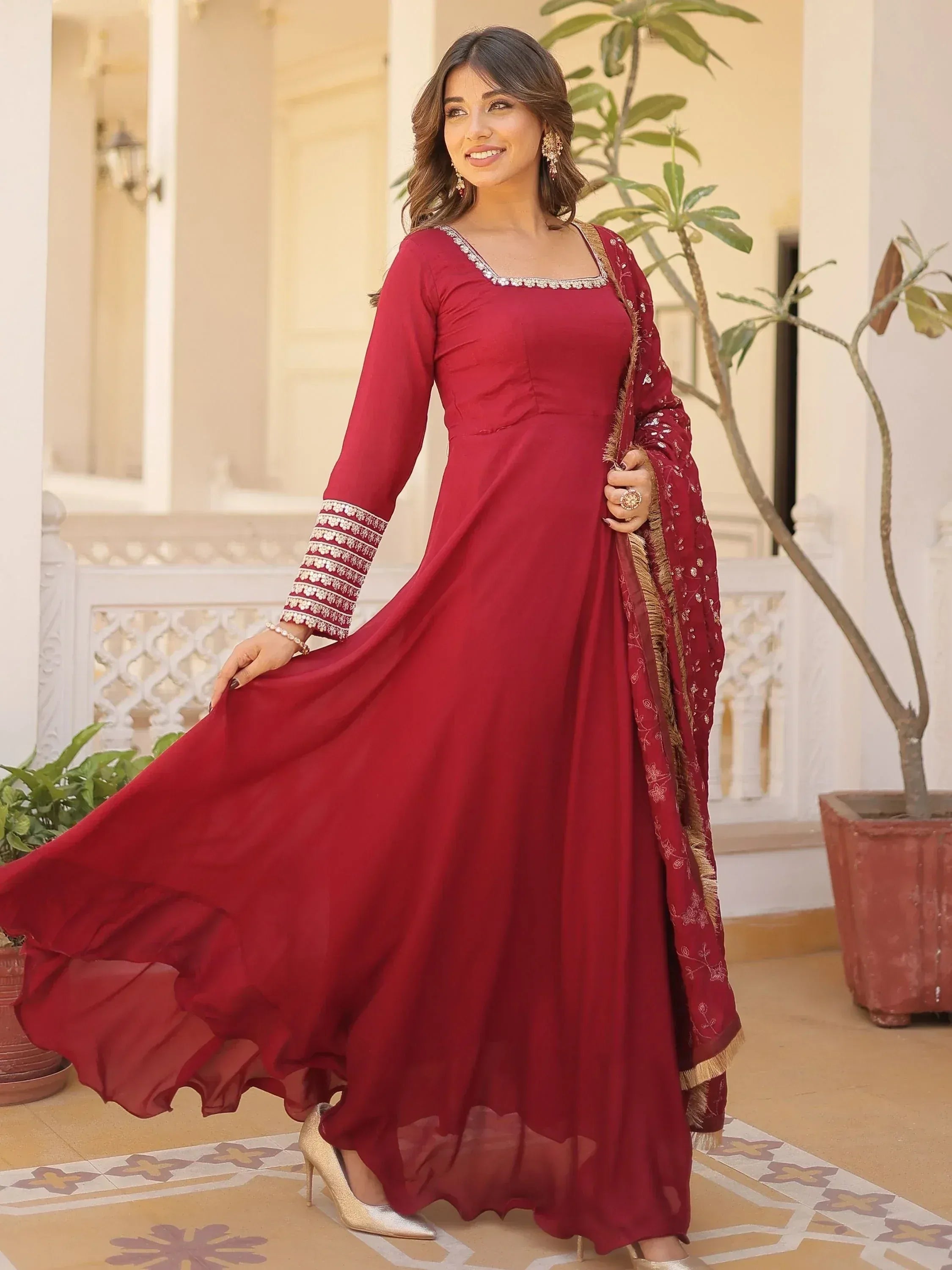 Elegant maroon anarkali suit with gold embroidery, perfect for Indian ethnic wear occasions