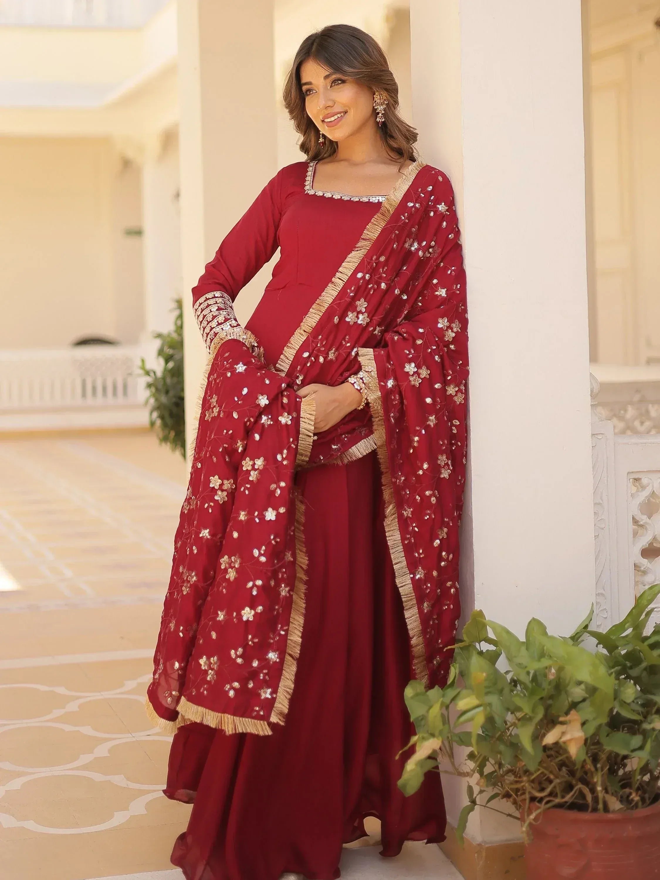 Maroon embroidered salwar kameez with floral dupatta, perfect for Indian ethnic wear occasions