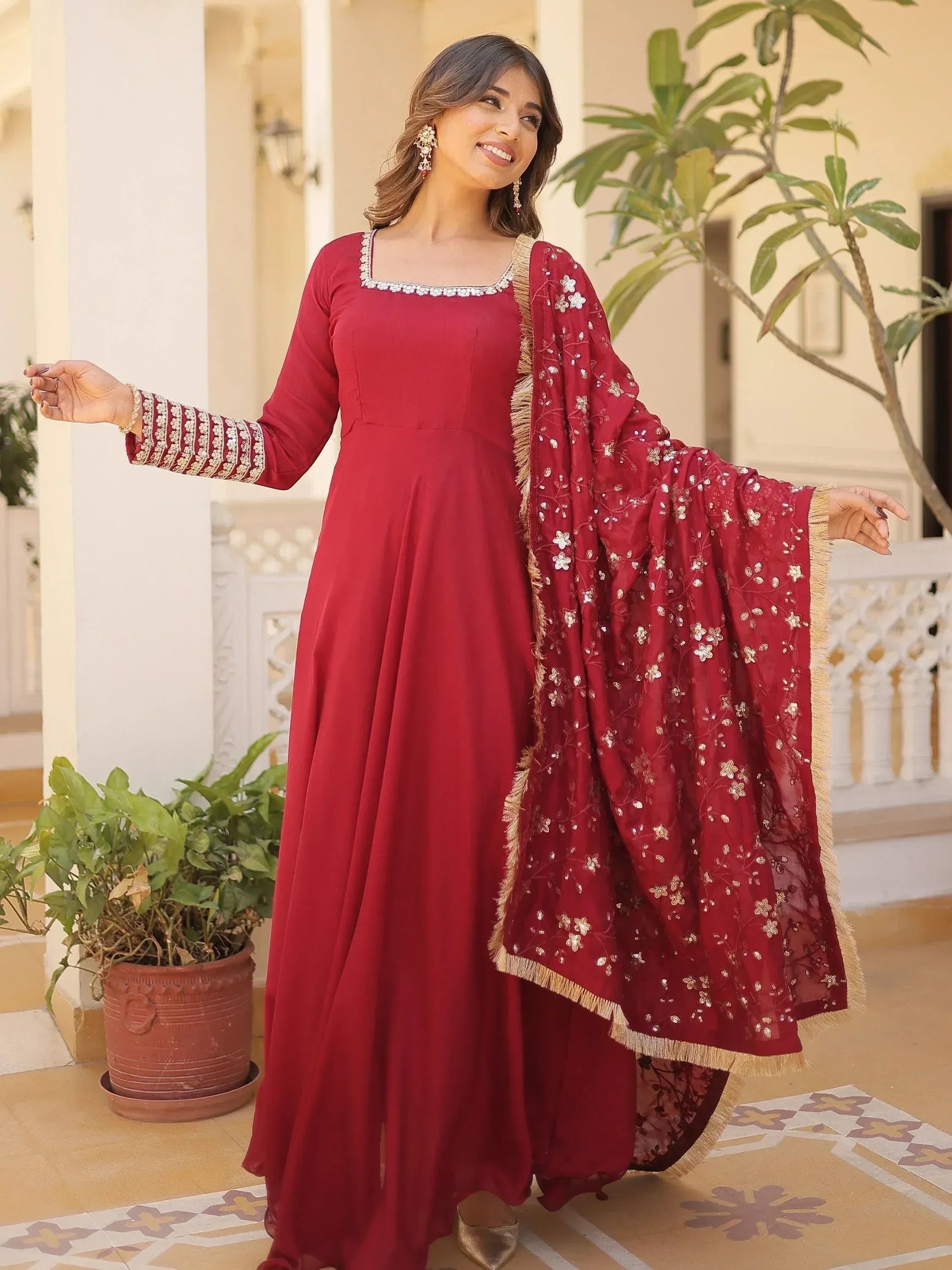 Maroon ethnic anarkali gown with floral embroidery and dupatta, perfect for Indian occasions