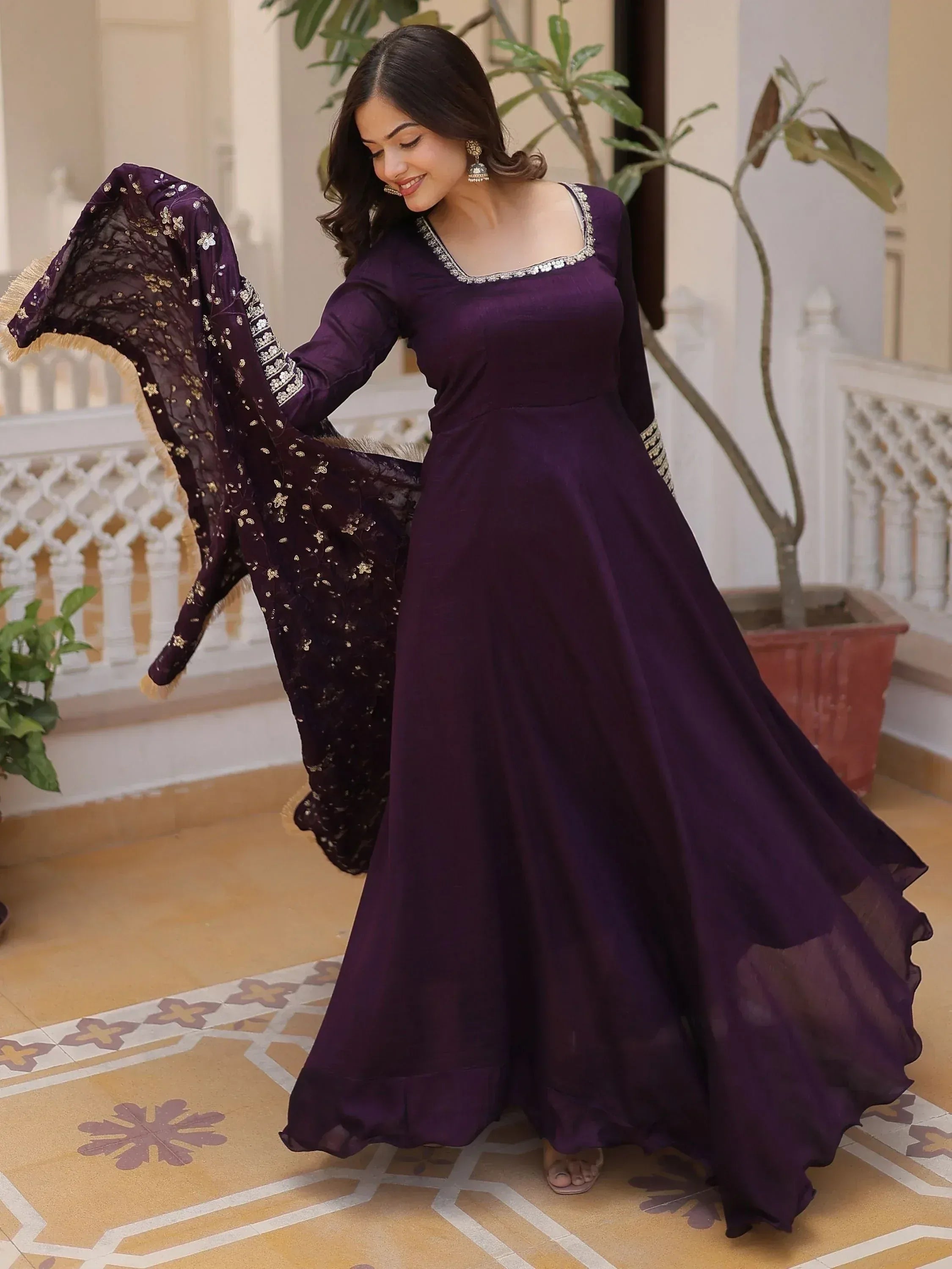 Purple ethnic gown with embroidered dupatta, perfect for Indian weddings and festive occasions.