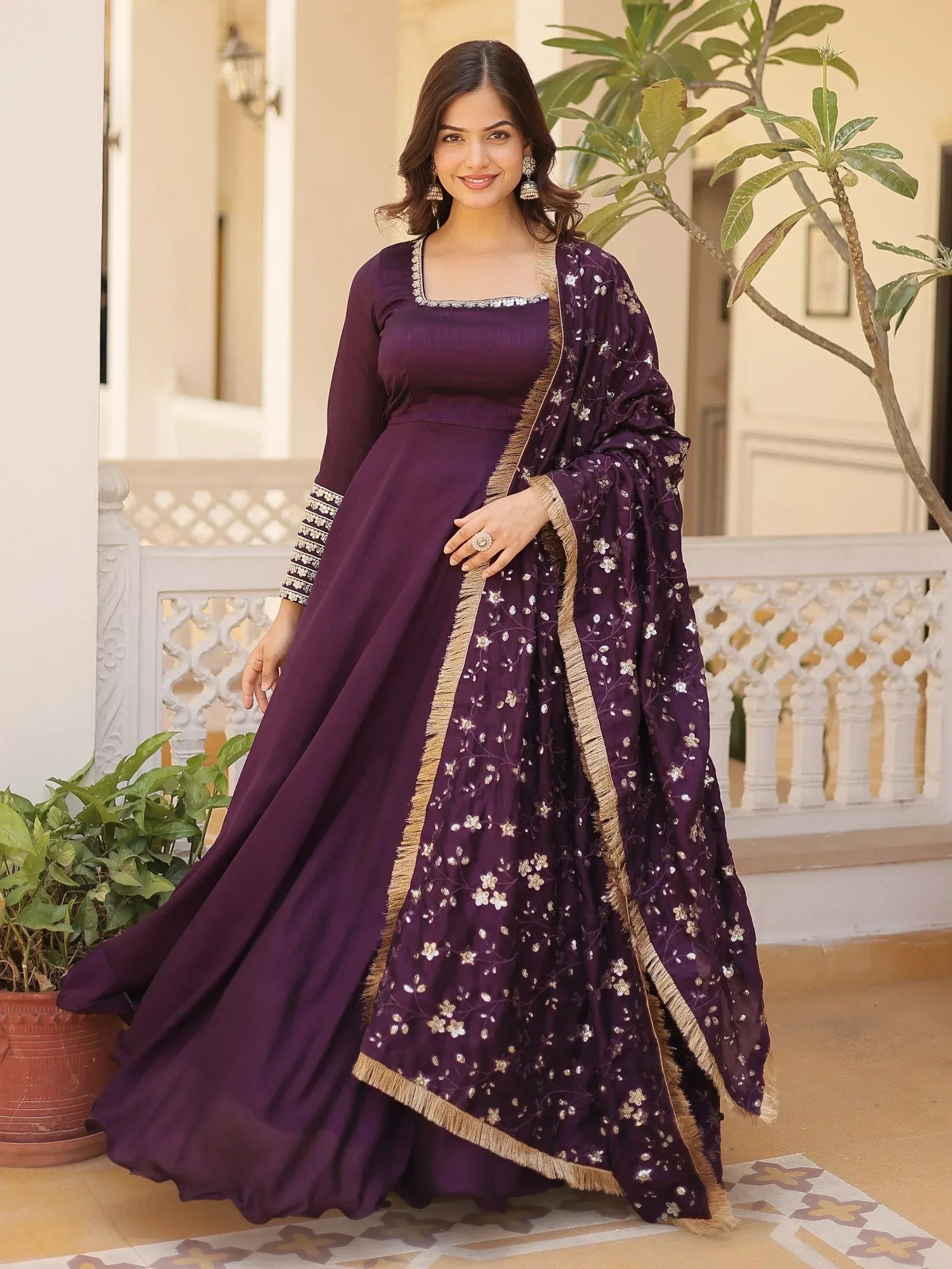 Purple designer anarkali suit with floral embroidery and gold trim, perfect for Indian ethnic occasions