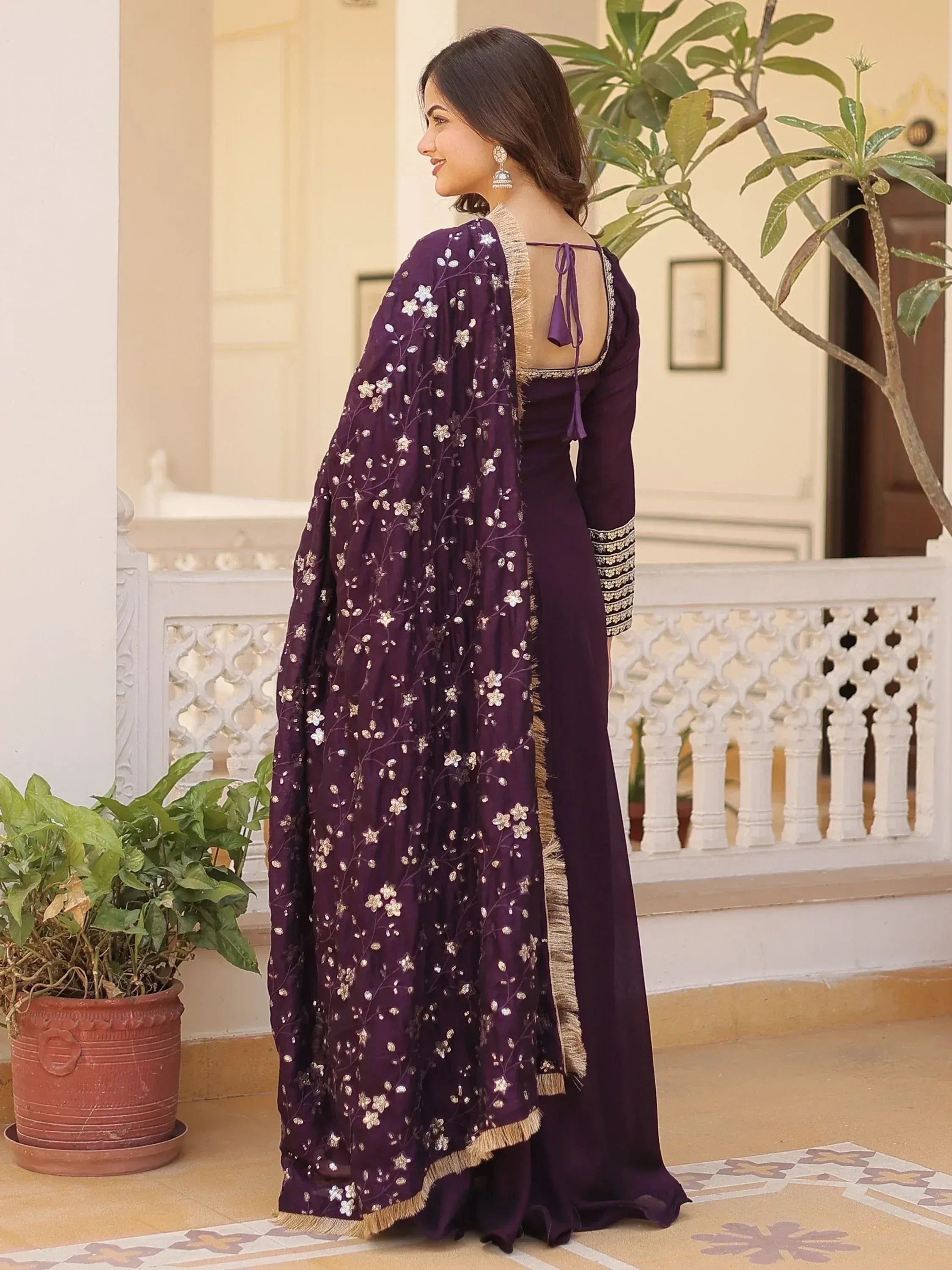 Purple embroidered ethnic gown with floral dupatta, back view, perfect for Indian occasions