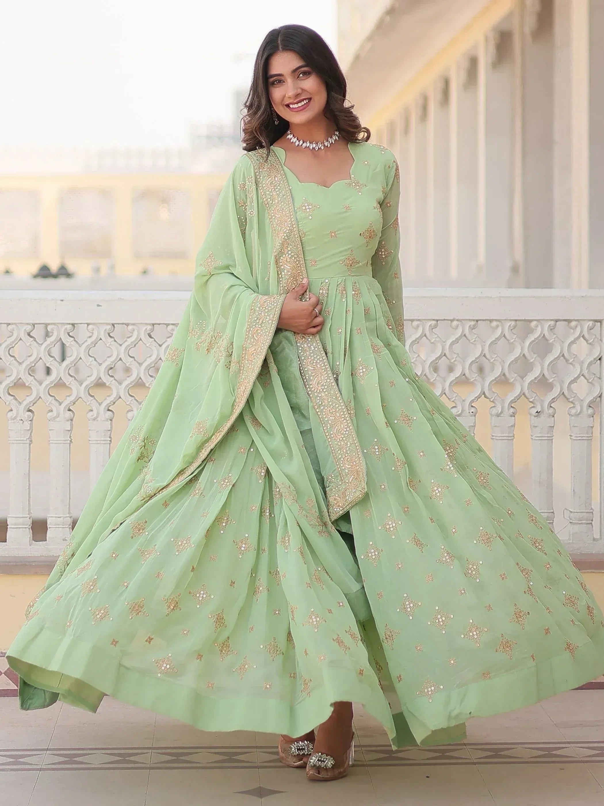 Mint green embroidered anarkali suit with gold detailing, perfect for Indian ethnic wear occasions