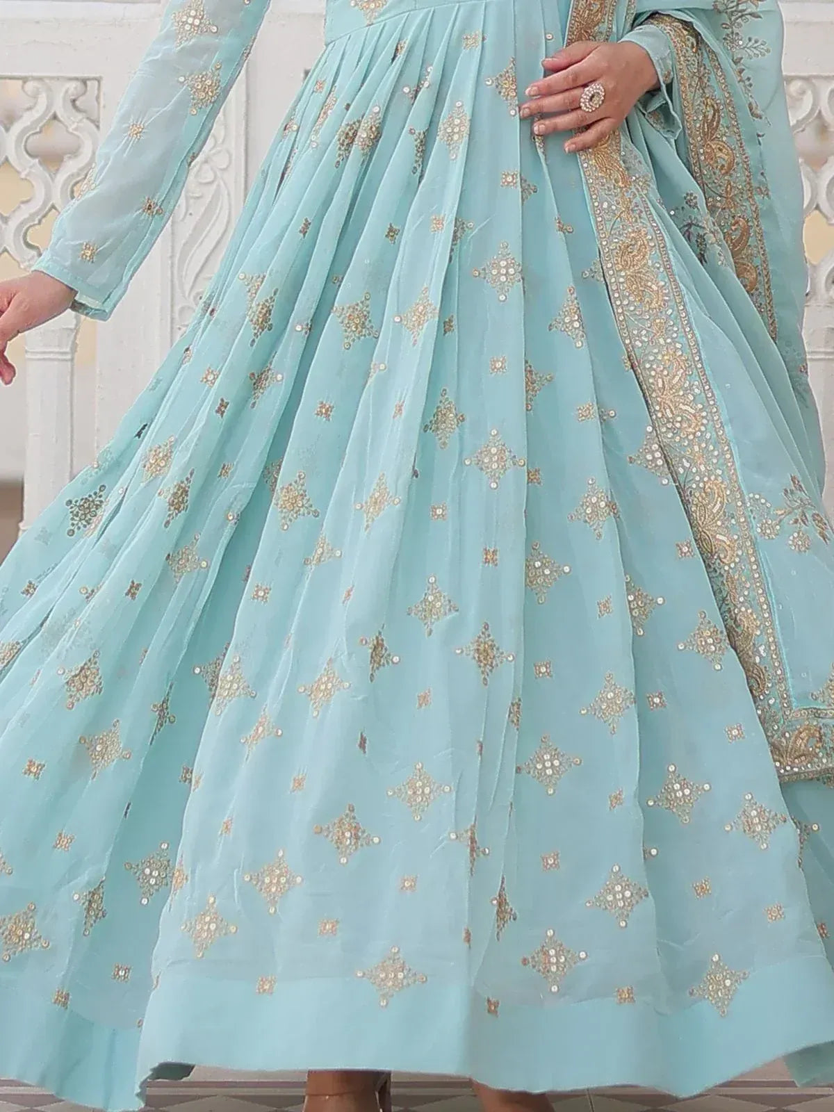 Light blue ethnic anarkali with gold embroidery and sequins, perfect for Indian occasions