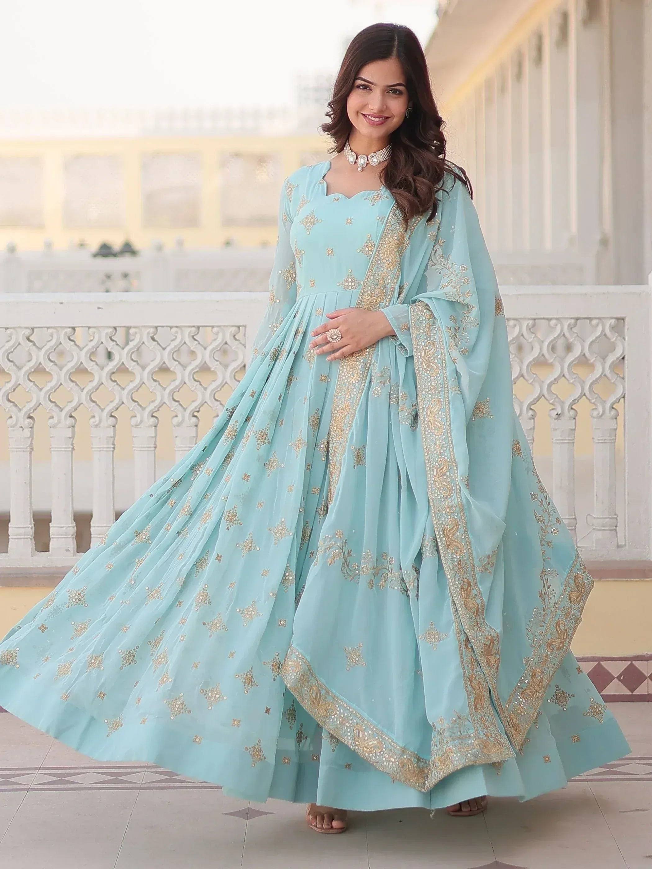 Light blue embroidered anarkali suit with gold detailing, perfect for Indian ethnic occasions