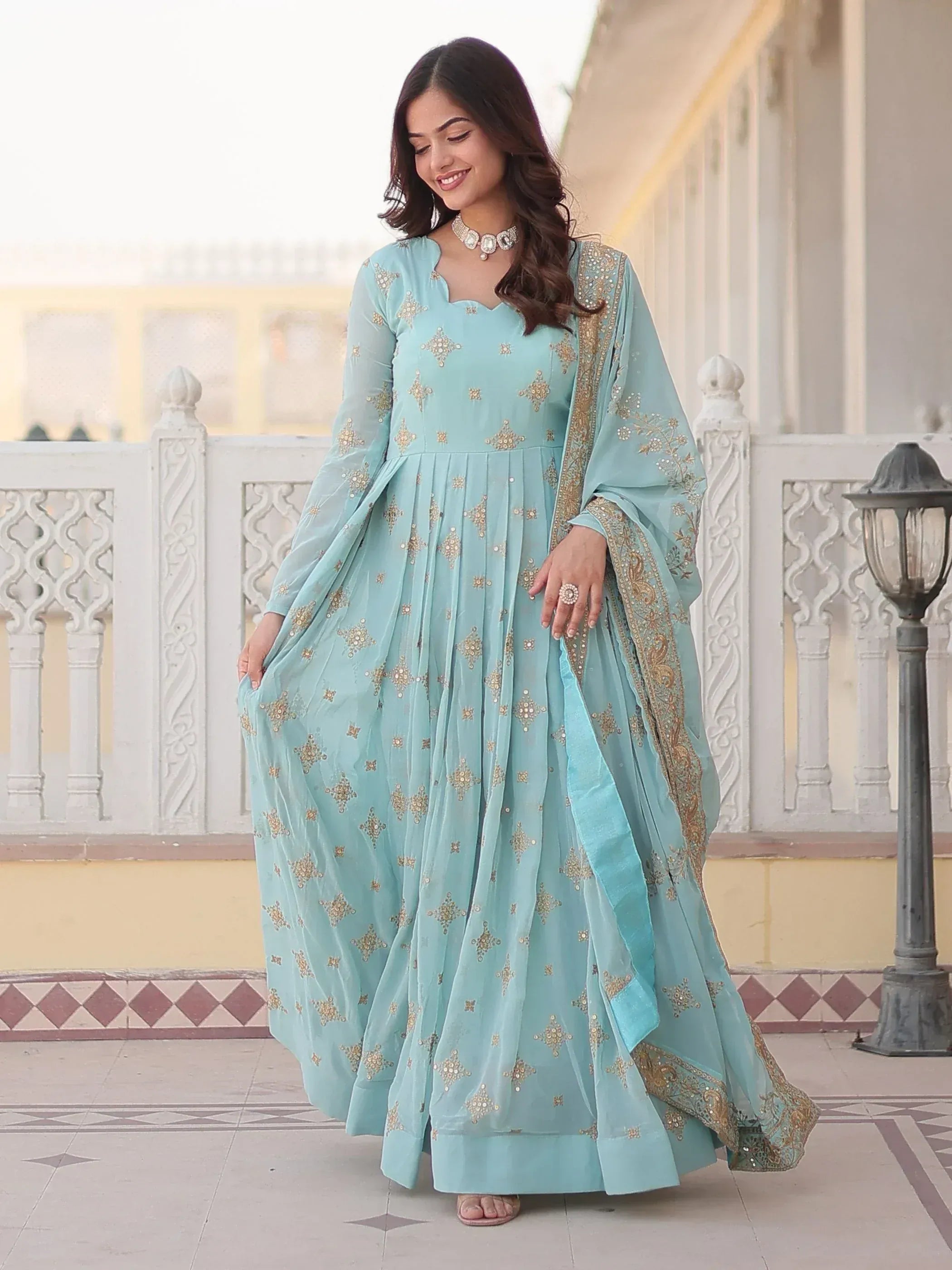 Light blue embroidered anarkali suit with gold detailing, perfect for Indian ethnic occasions