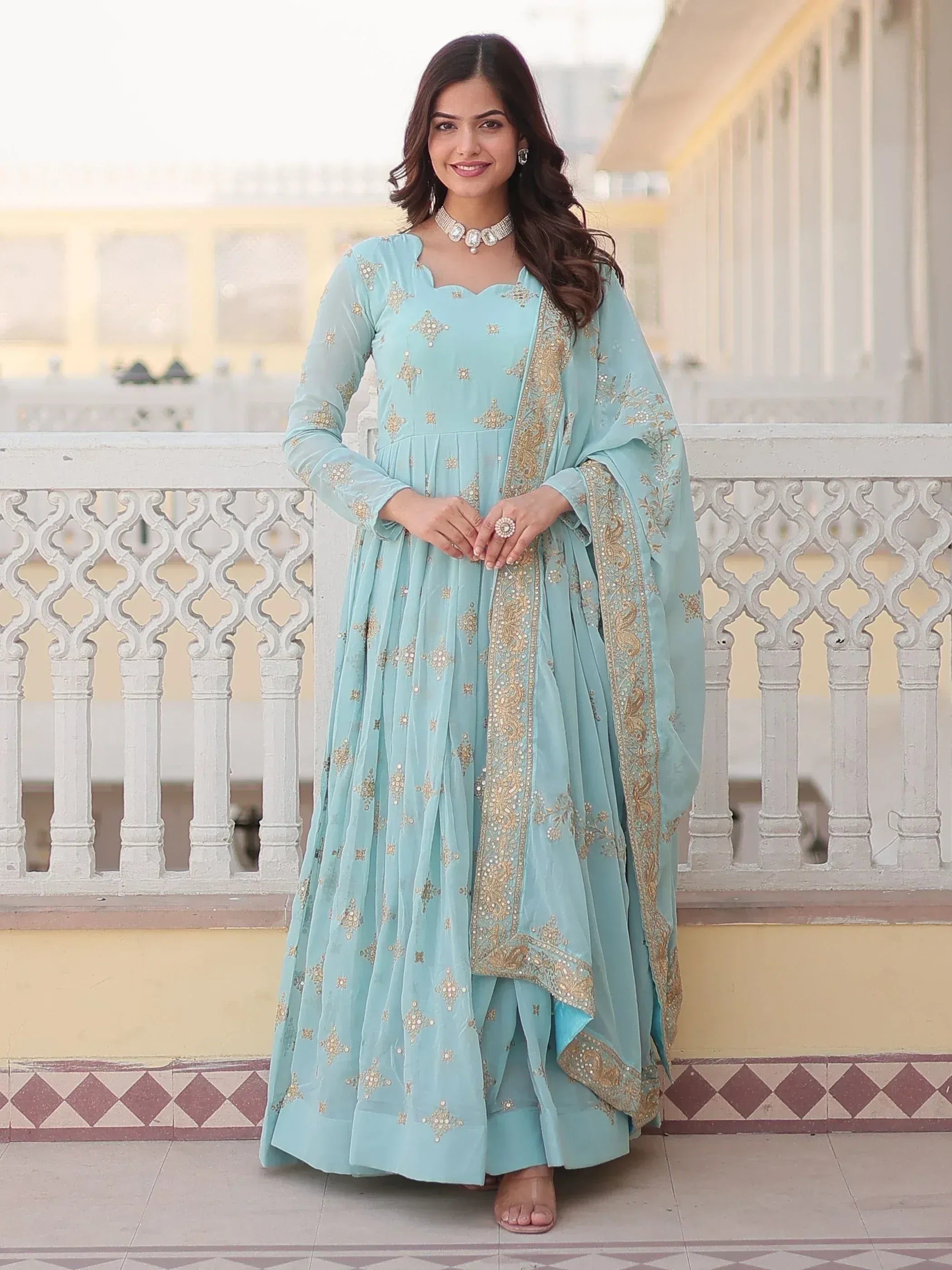 Light blue embroidered anarkali suit with gold detailing, perfect for Indian ethnic occasions