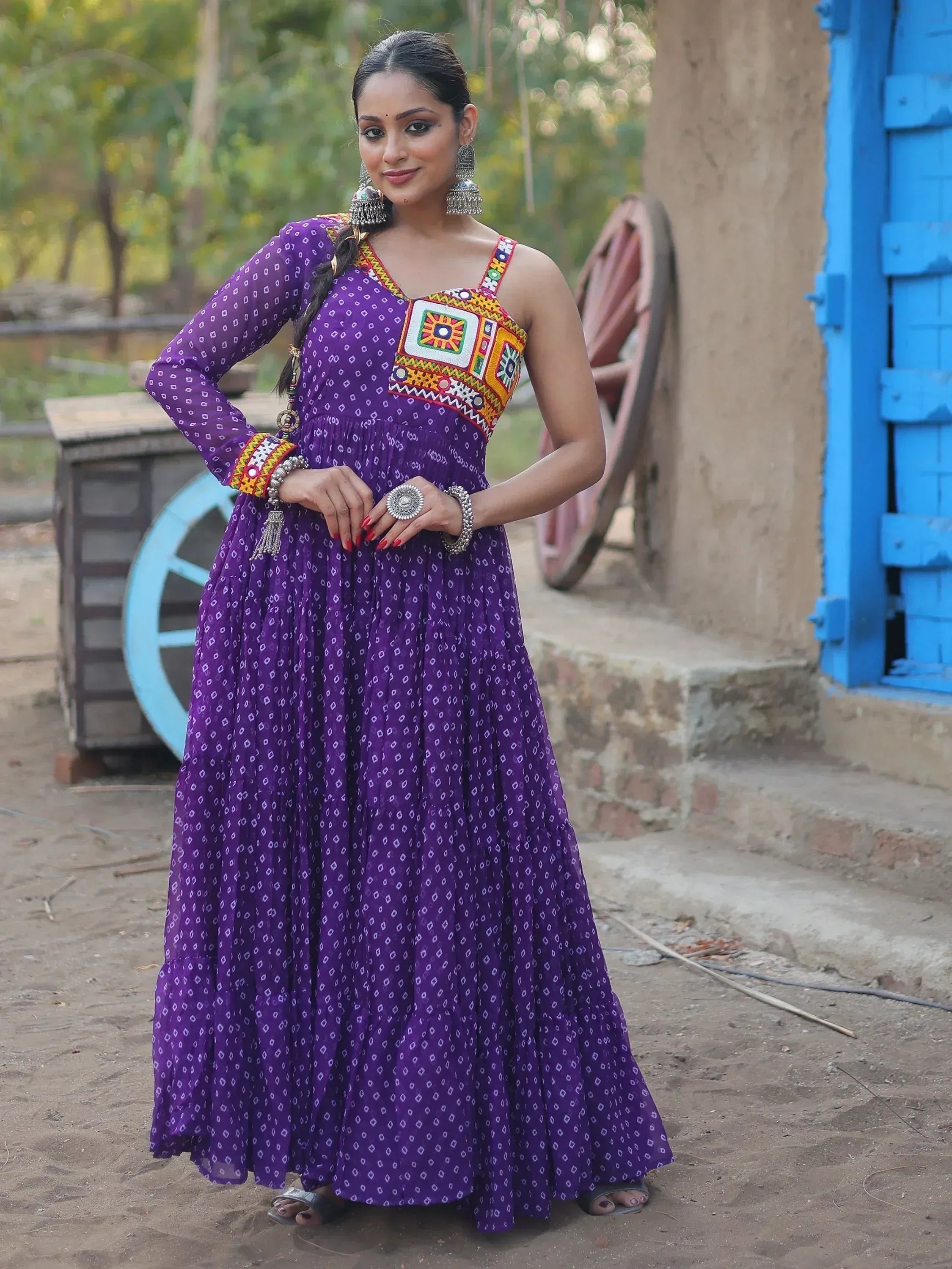 Purple ethnic gown with colorful embroidery, perfect for Indian festive wear and traditional occasions.