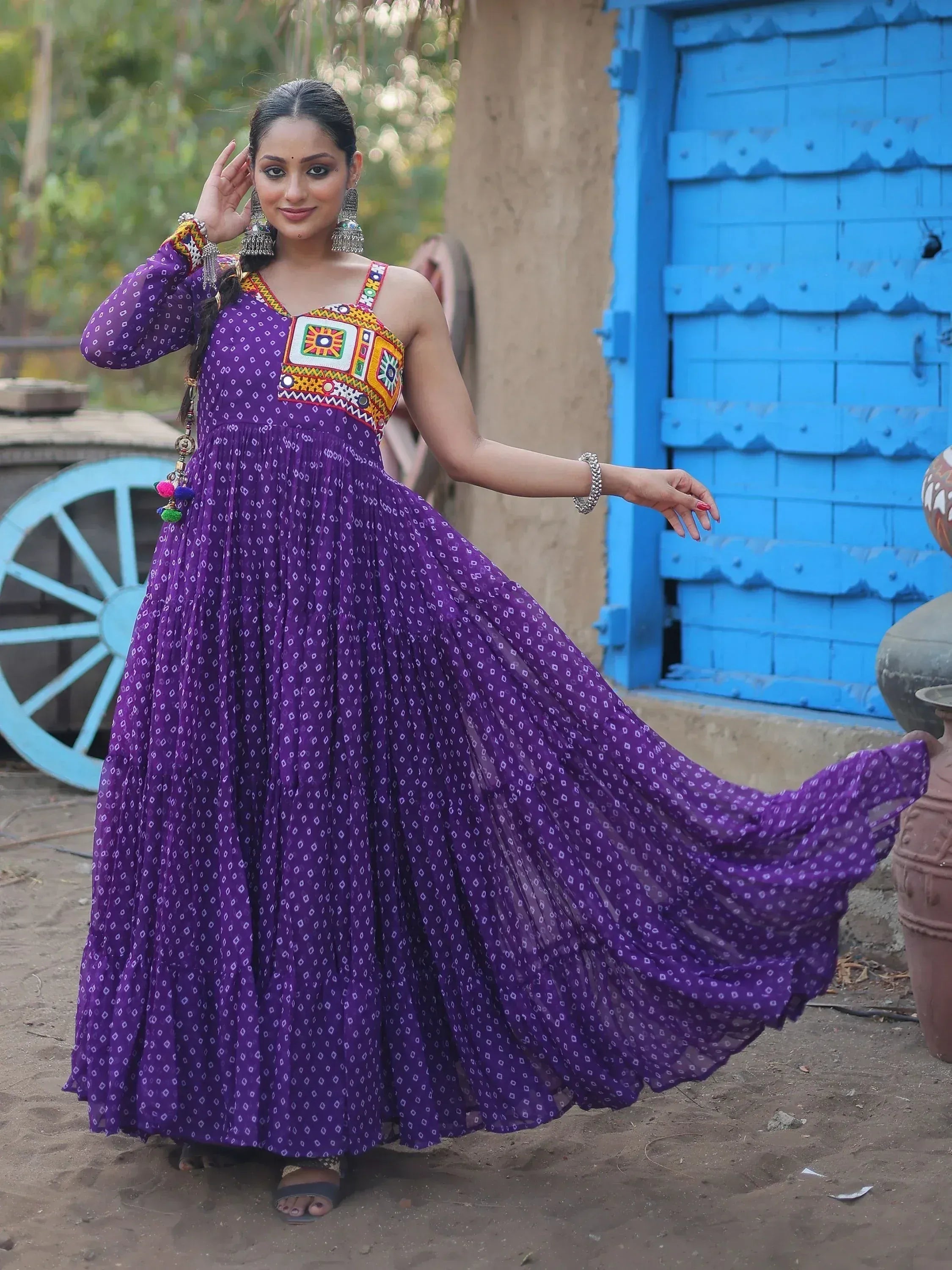 Purple ethnic gown with colorful embroidery, perfect for Indian festivals and occasions.