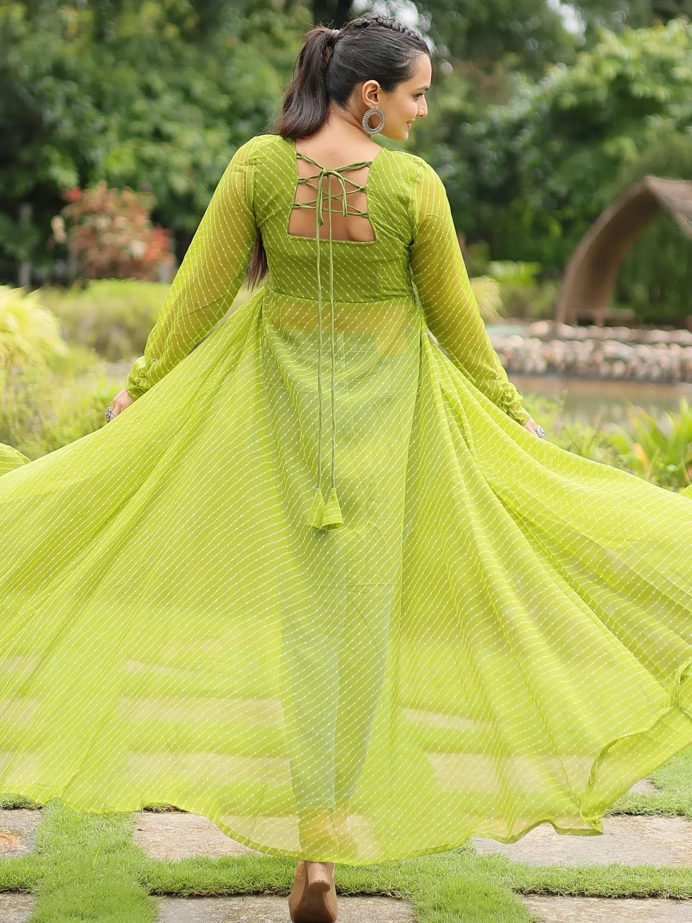 Lime green ethnic gown with white polka dots, crisscross back, and flared skirt for women