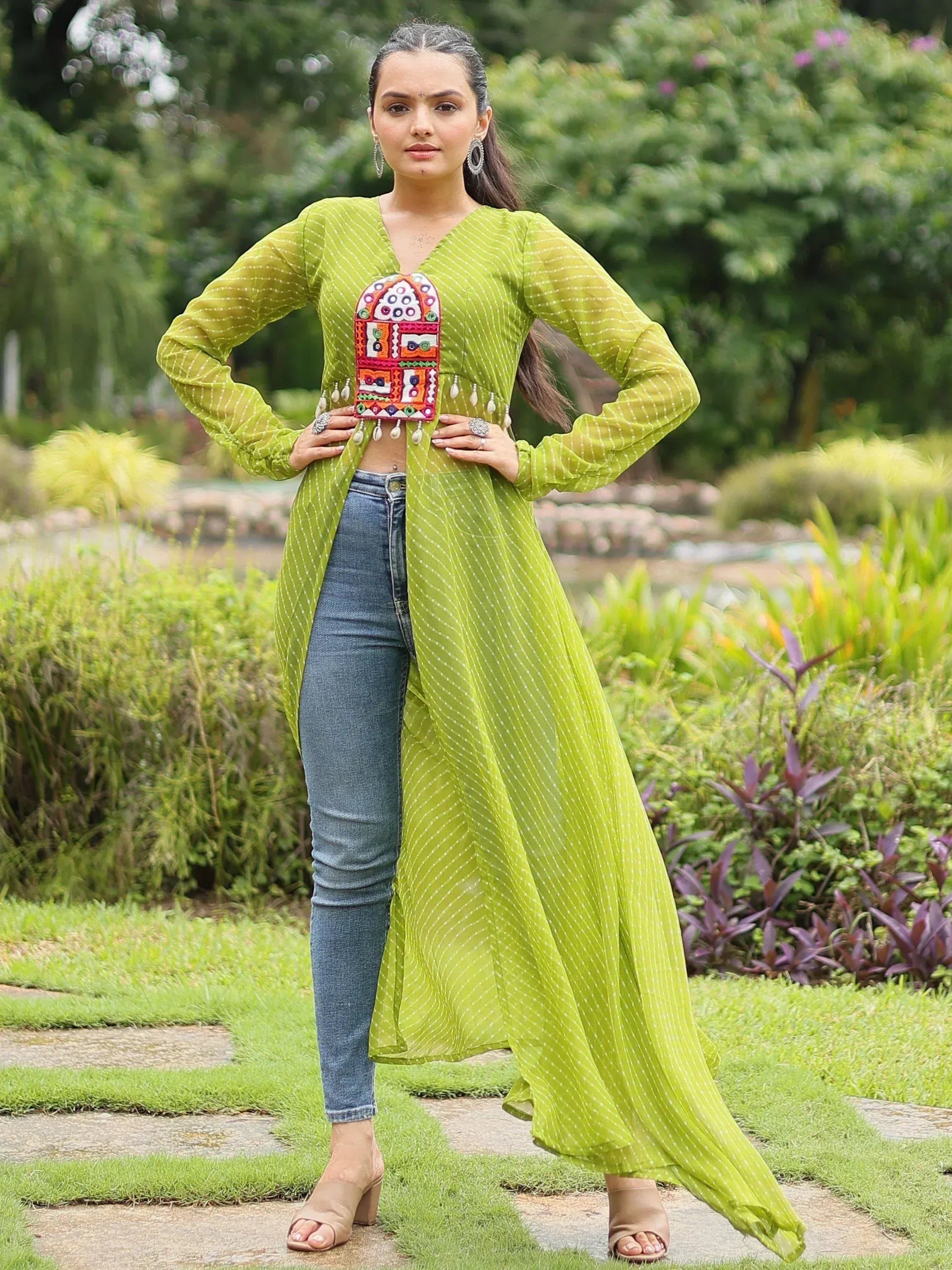 Green embroidered ethnic kurti with jeans, perfect for casual Indian wear