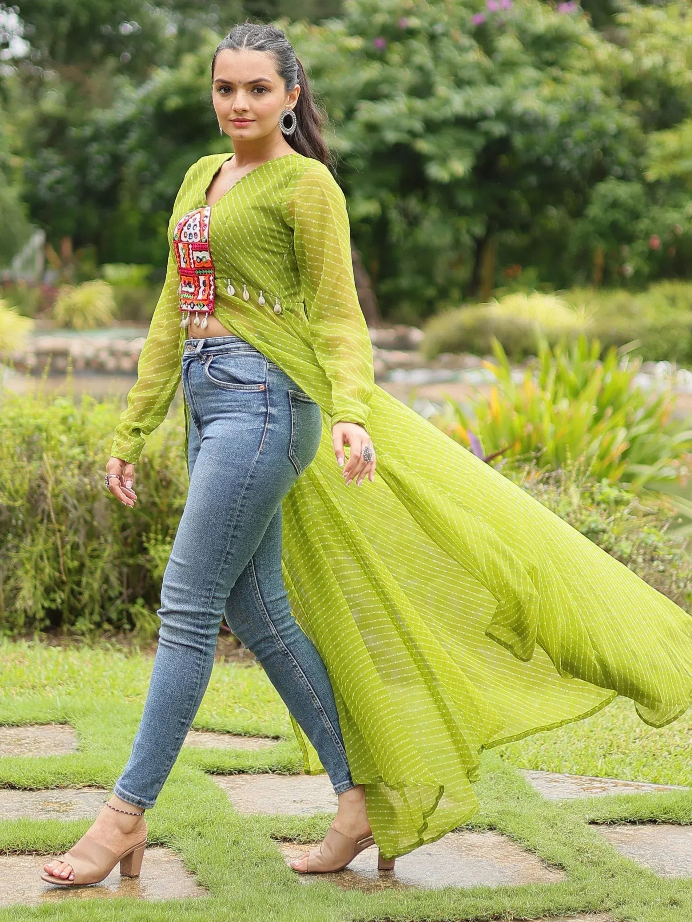 Green embroidered ethnic top with jeans, perfect for casual outings