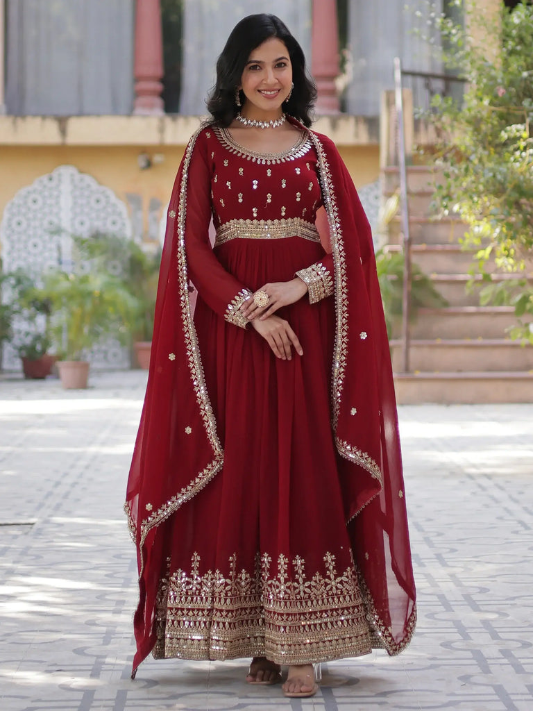 Wonderful Maroon Zari Embroidered Georgette Wedding Wear Gown