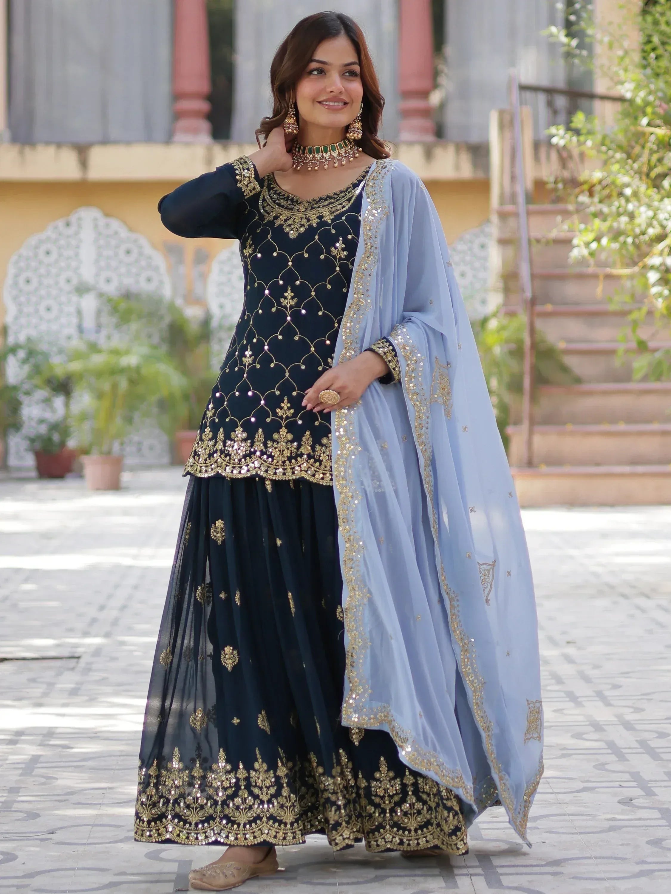 Elegant navy blue embroidered salwar kameez with light blue dupatta, perfect for Indian ethnic occasions.
