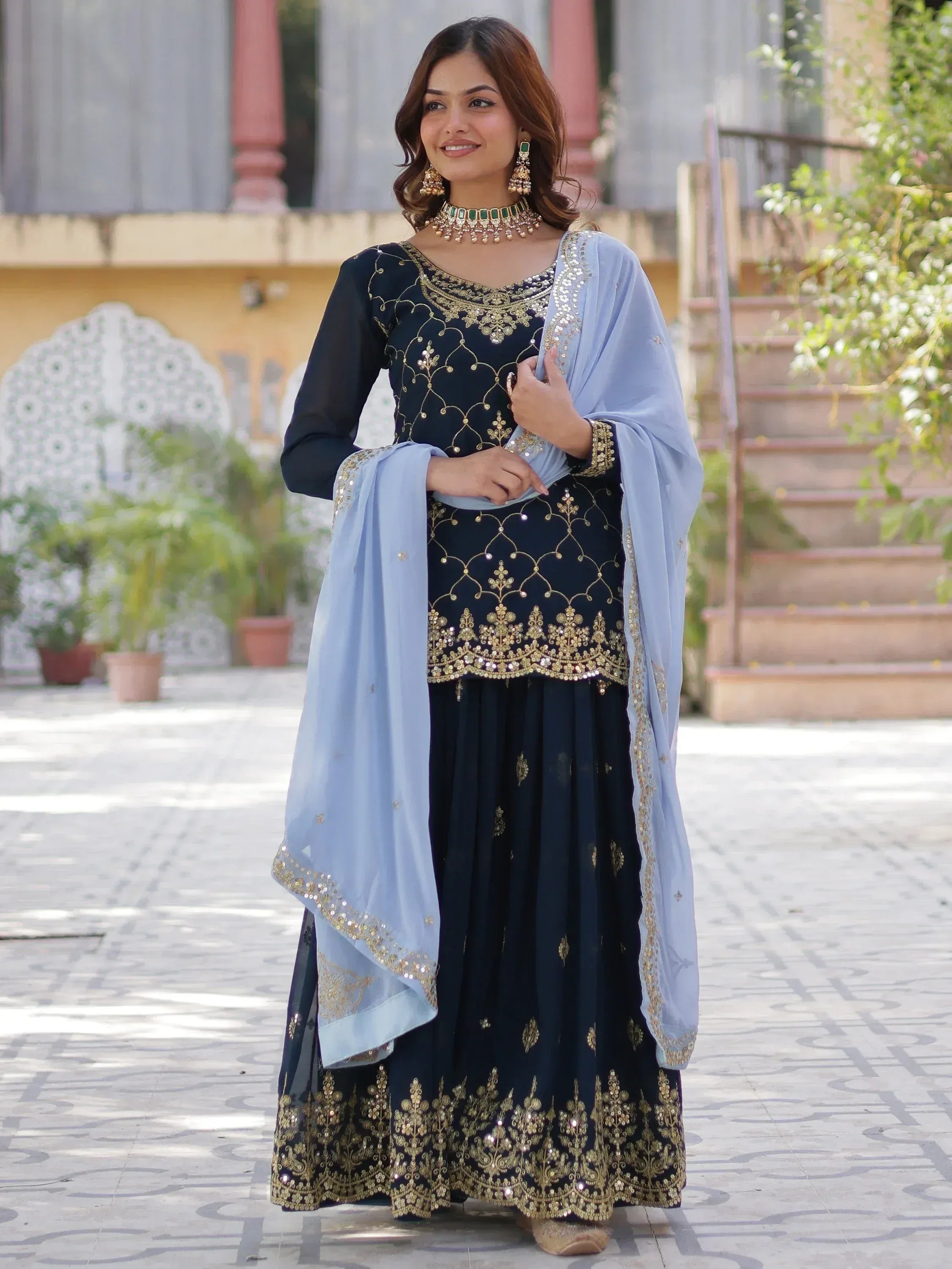 Navy blue embroidered salwar kameez with gold detailing and light blue dupatta, perfect for Indian ethnic wear