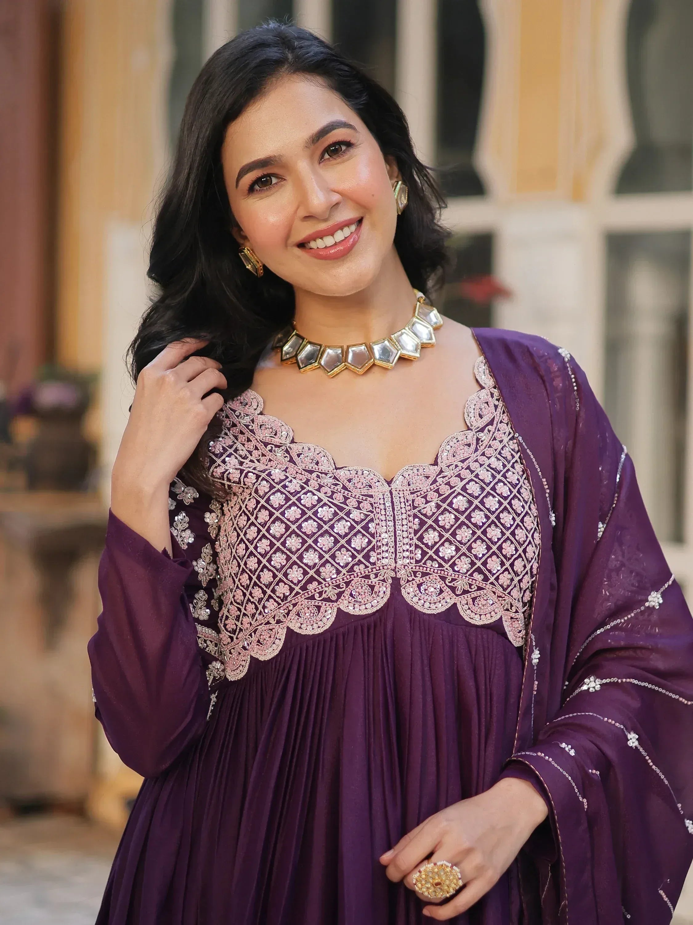 Purple ethnic gown with pink embroidery, perfect for Indian occasions and festive wear.