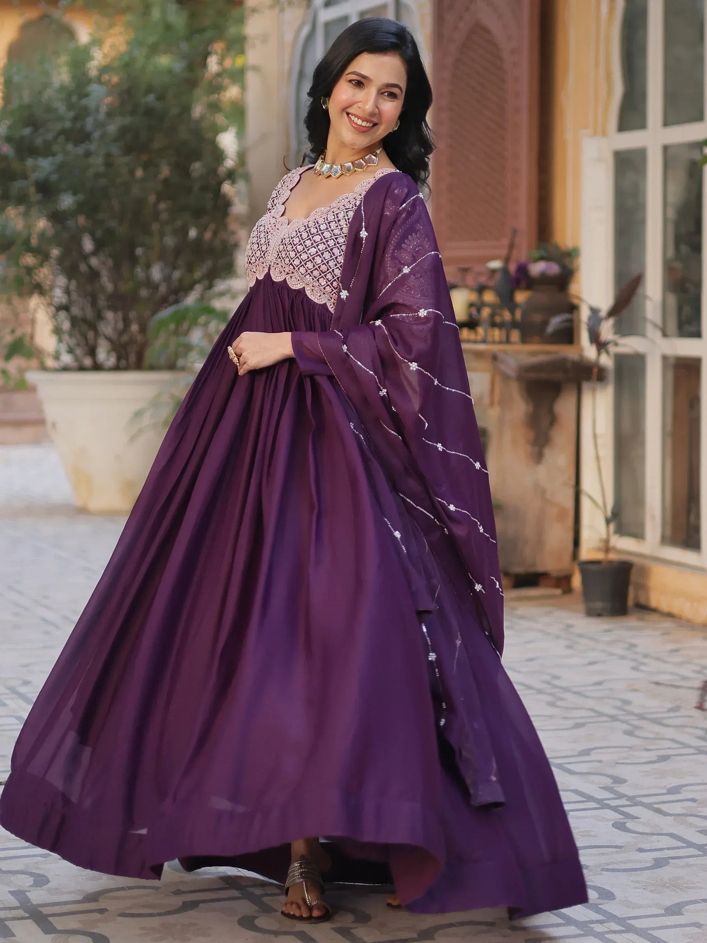 Purple ethnic gown with intricate embroidery, perfect for Indian occasions and festive wear