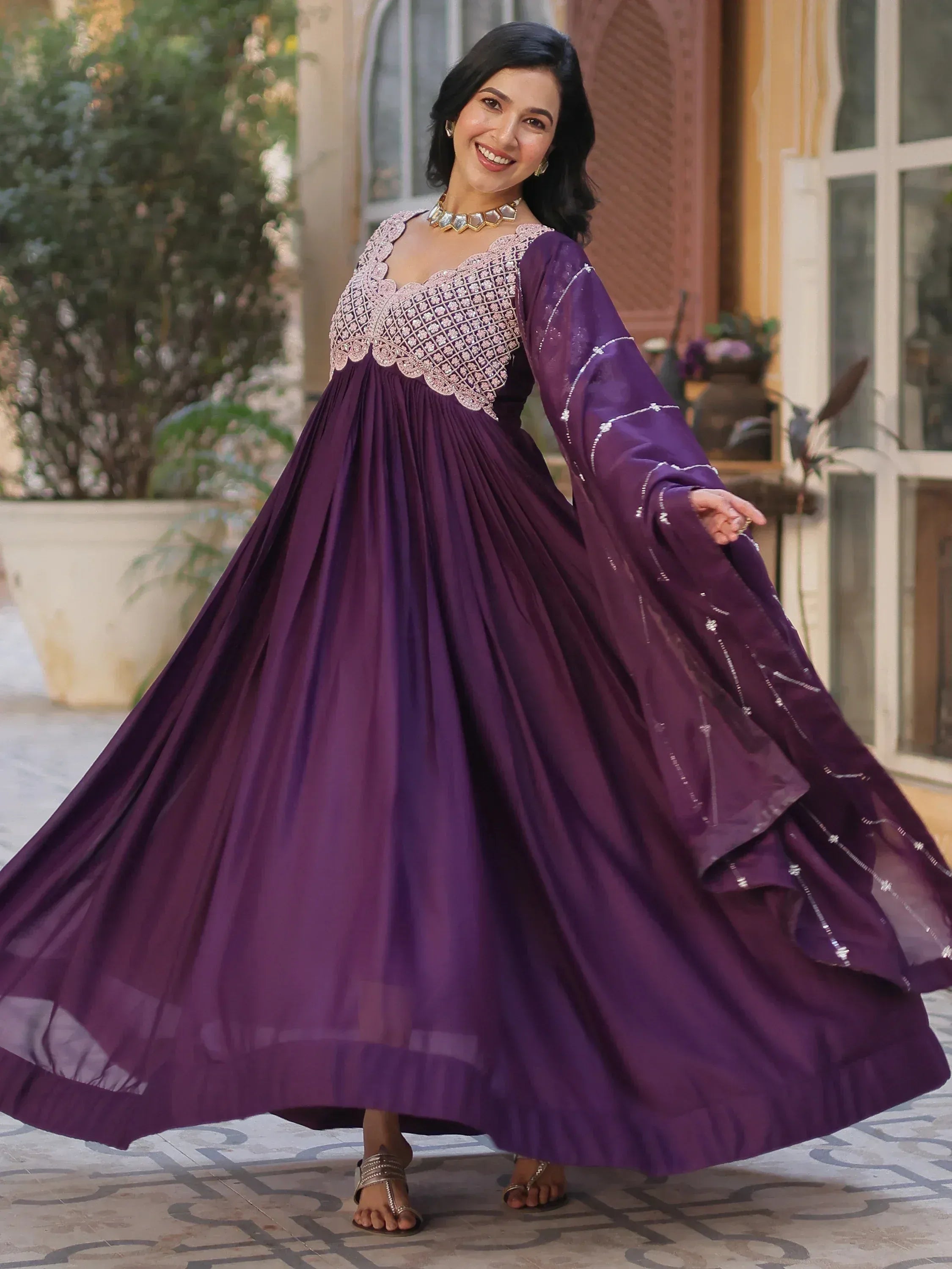 Purple ethnic gown with embroidered bodice and flared skirt, perfect for Indian festive occasions