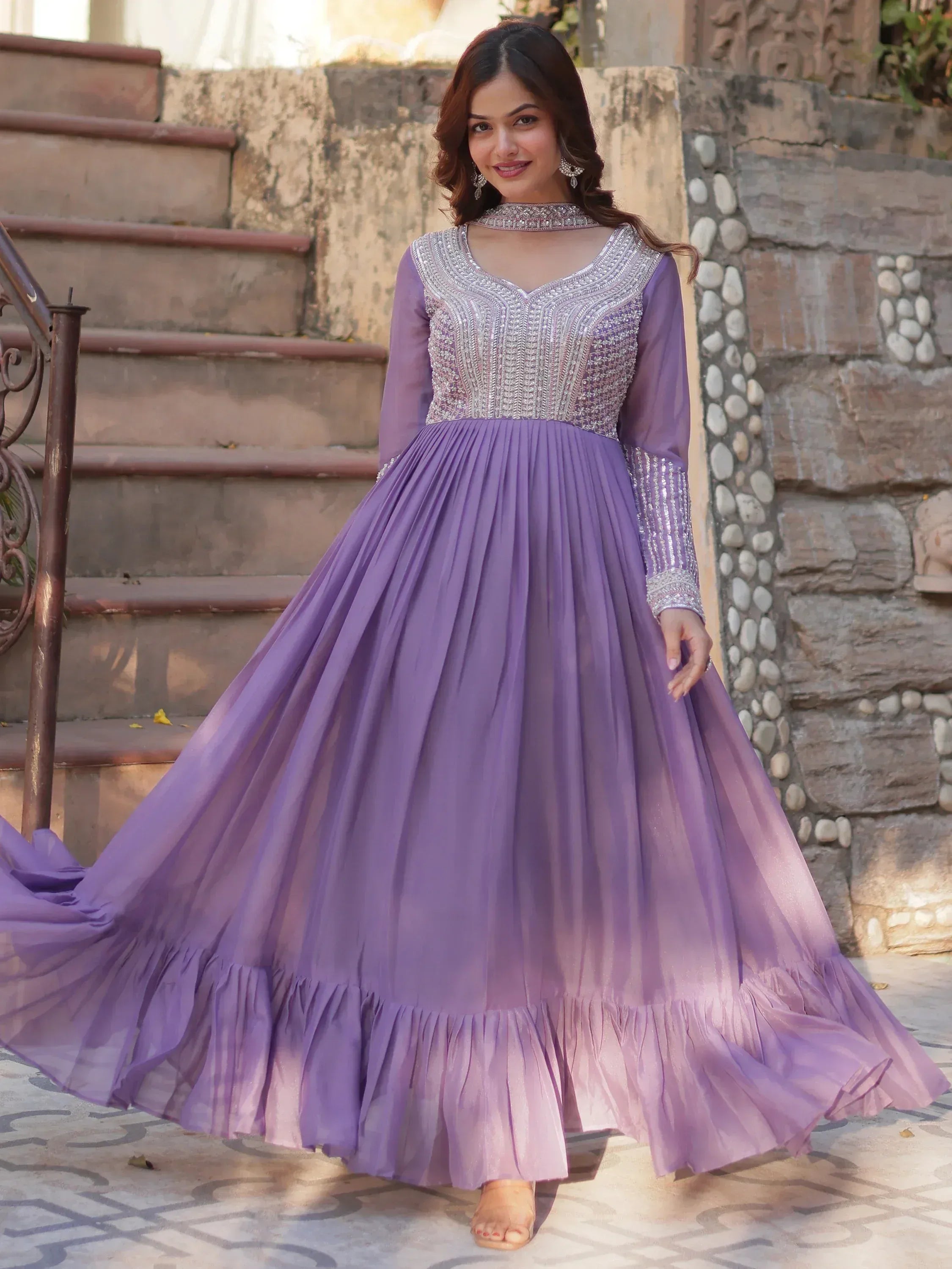 Purple ethnic gown with silver embroidery, pleated skirt, and choker neckline for Indian occasions