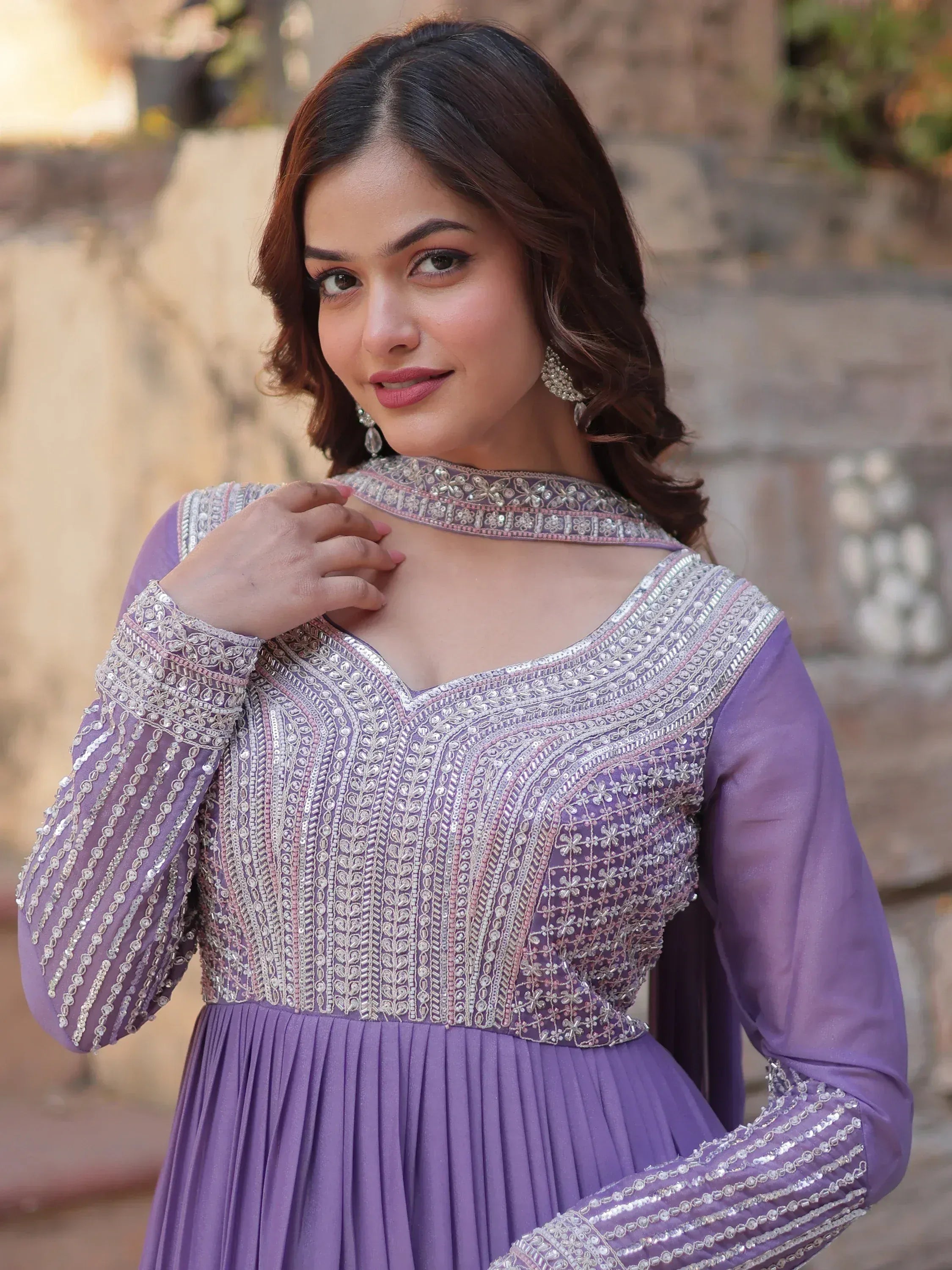Purple embroidered ethnic gown with silver detailing, perfect for Indian festive wear