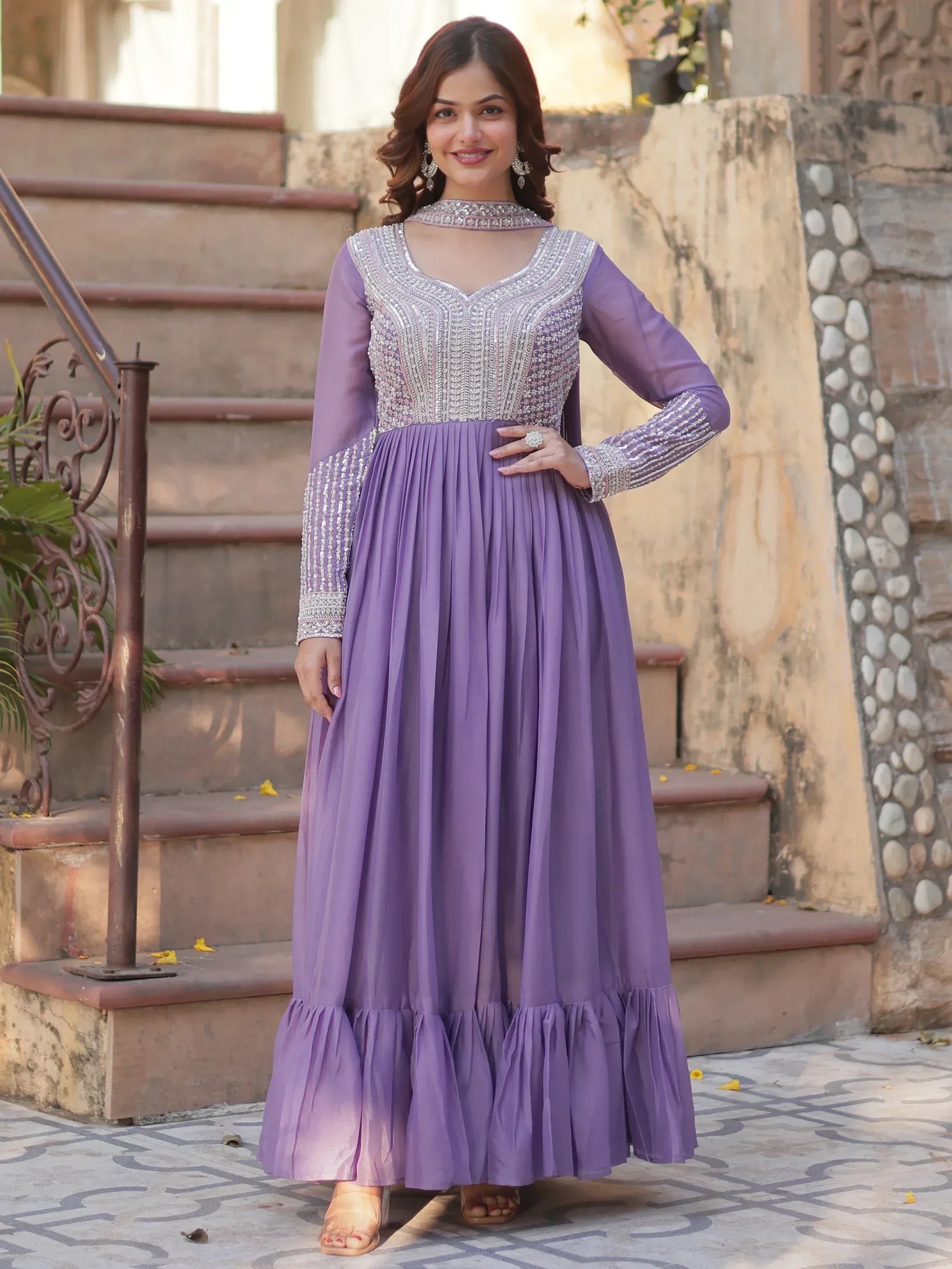 Purple embroidered ethnic gown with pleated skirt, perfect for Indian occasions and festive wear.