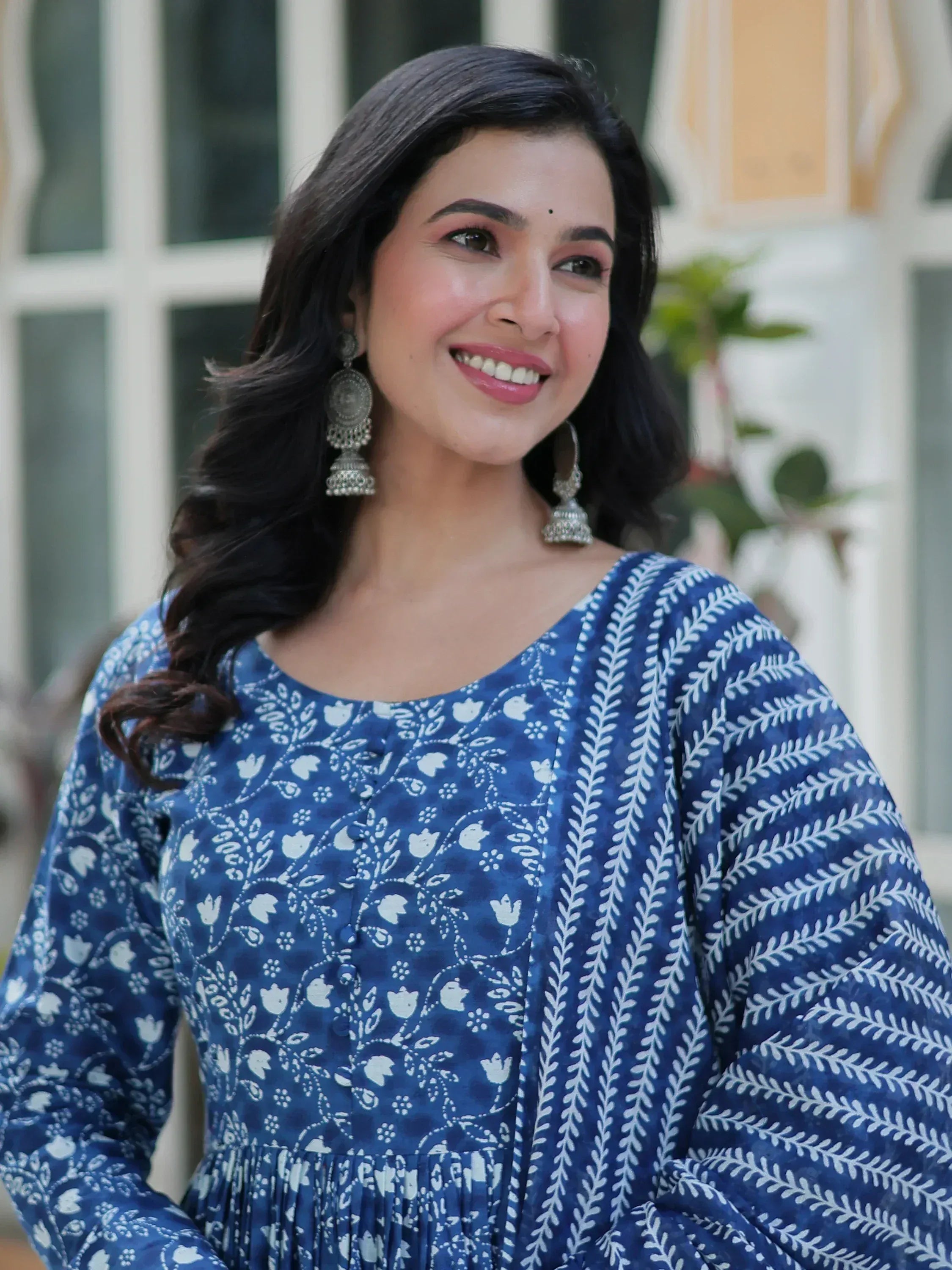 Blue floral printed ethnic kurta with white patterns and jhumka earrings