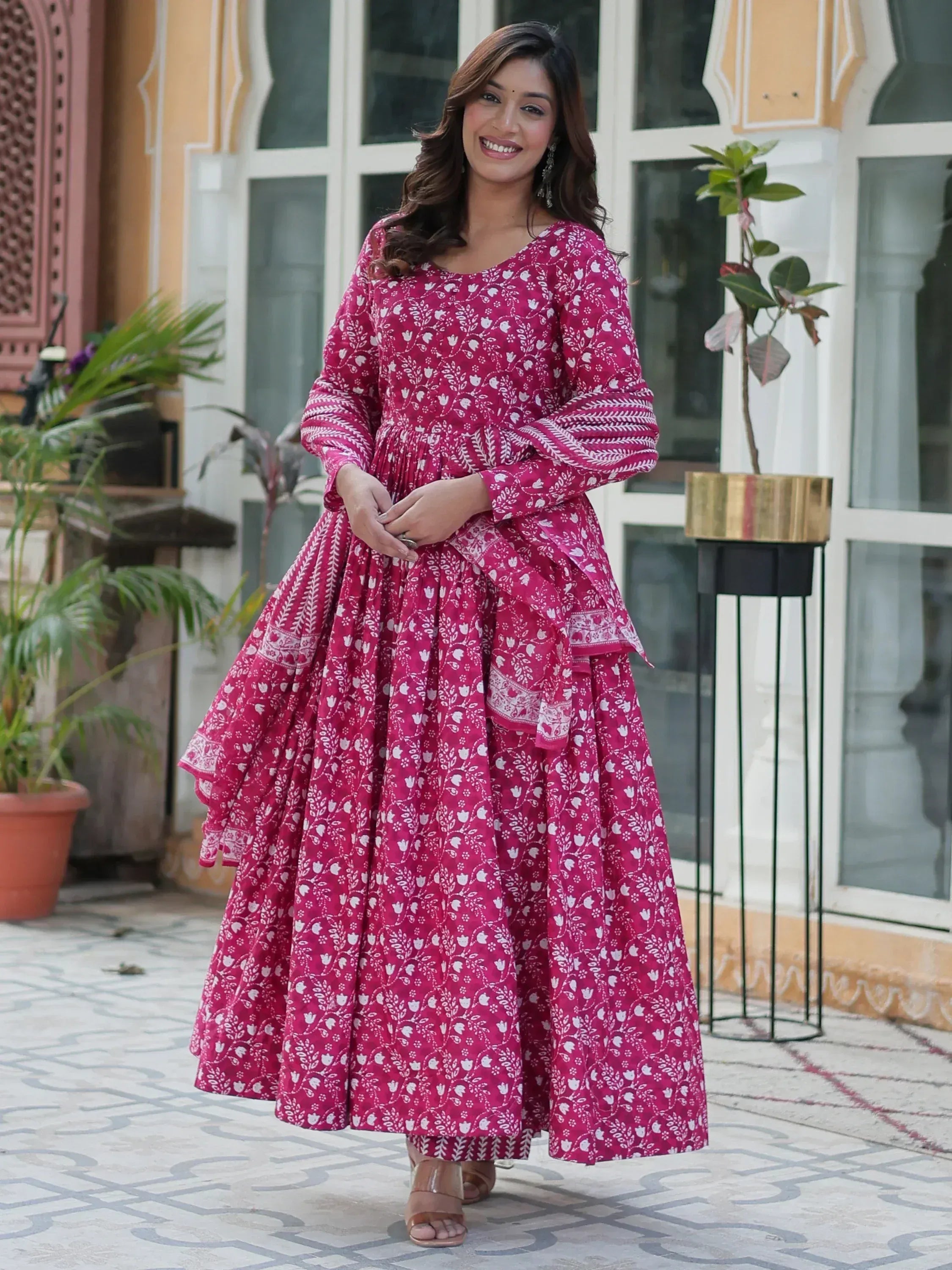 Pink floral print anarkali gown with flared skirt, perfect for ethnic occasions