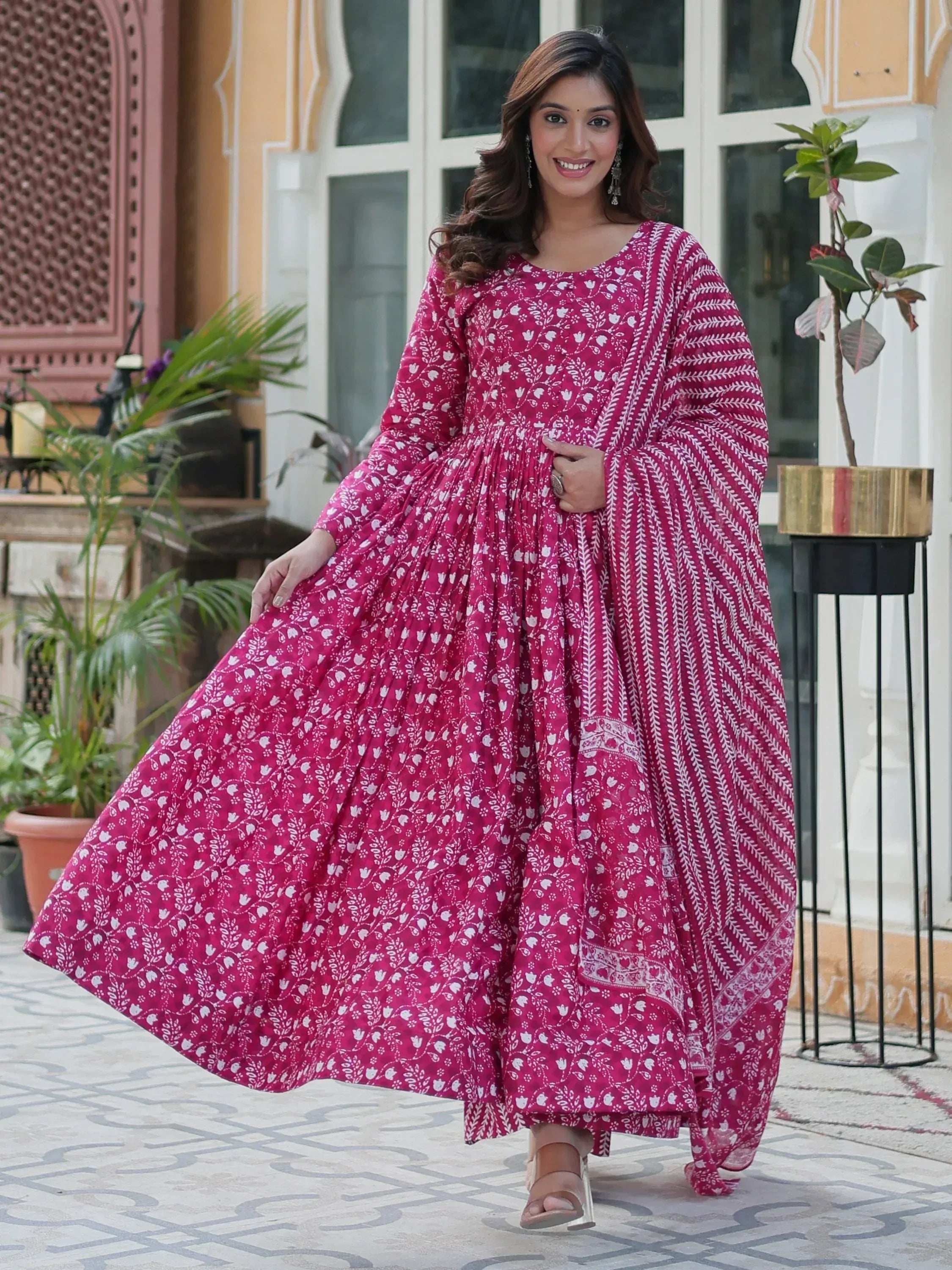 Pink floral printed ethnic gown with flared design for women