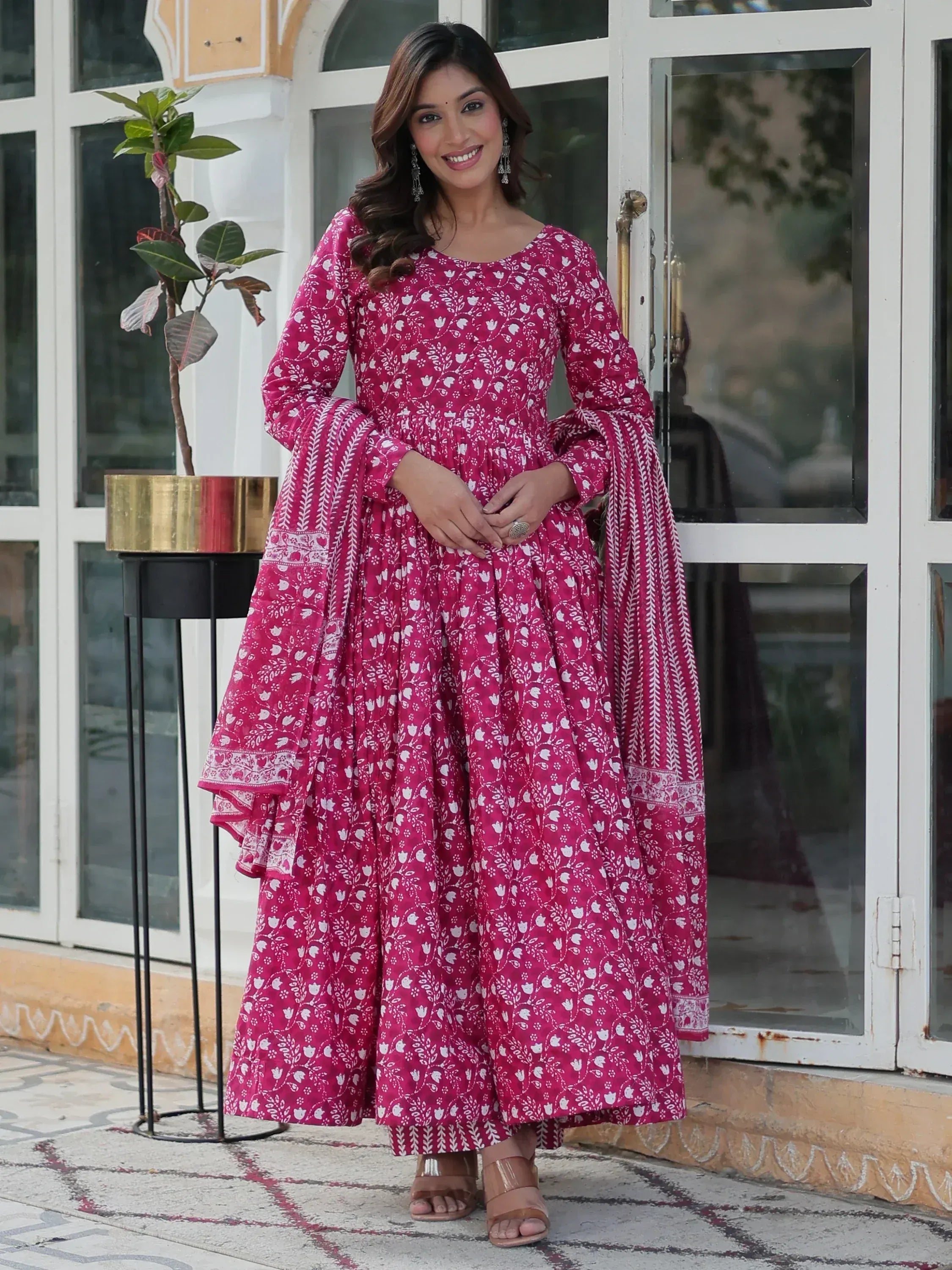 Pink floral printed ethnic gown with flared sleeves and matching dupatta