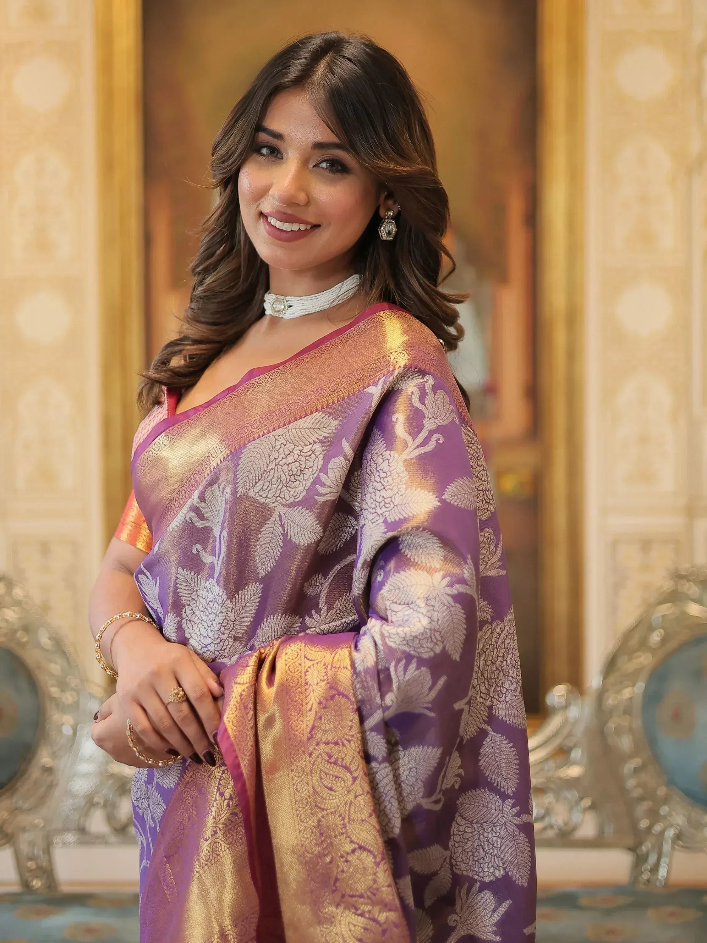 Elegant purple and gold floral saree with intricate weaving, perfect for Indian ethnic occasions