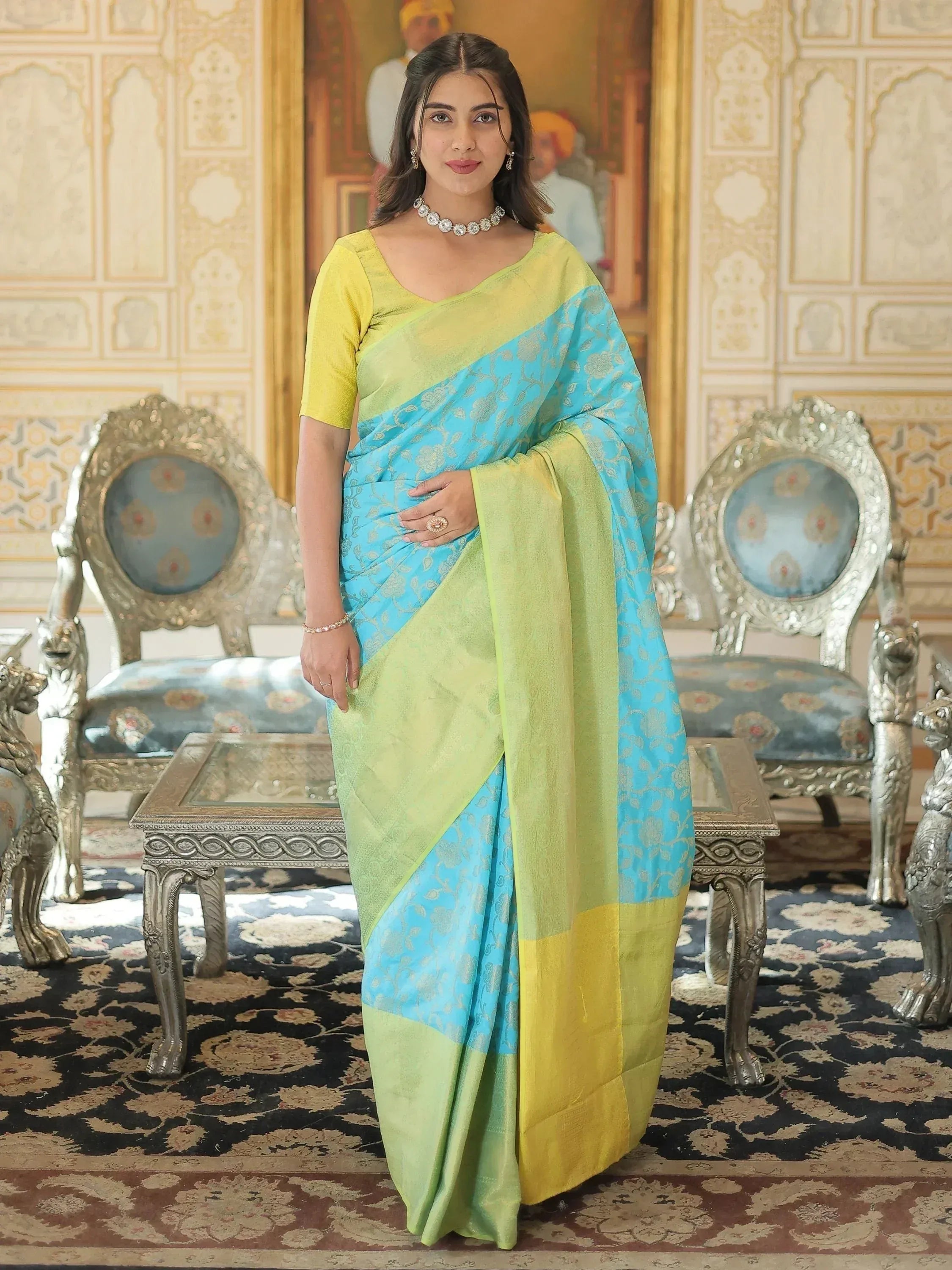 Woman in blue and green designer saree with yellow blouse, ethnic wear for festive occasions