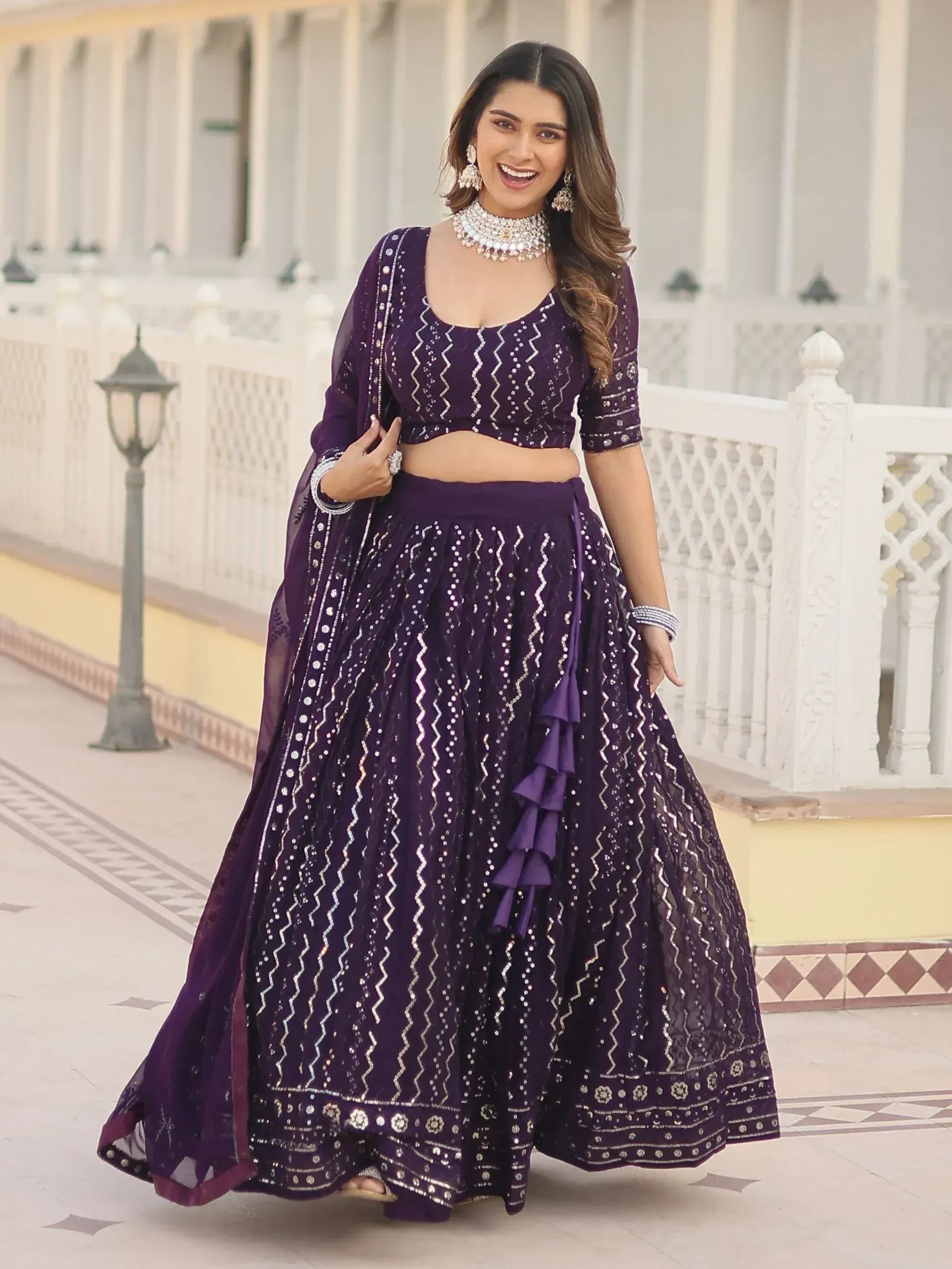 Purple designer lehenga choli with sequin work and ruffle detailing, perfect for Indian ethnic occasions