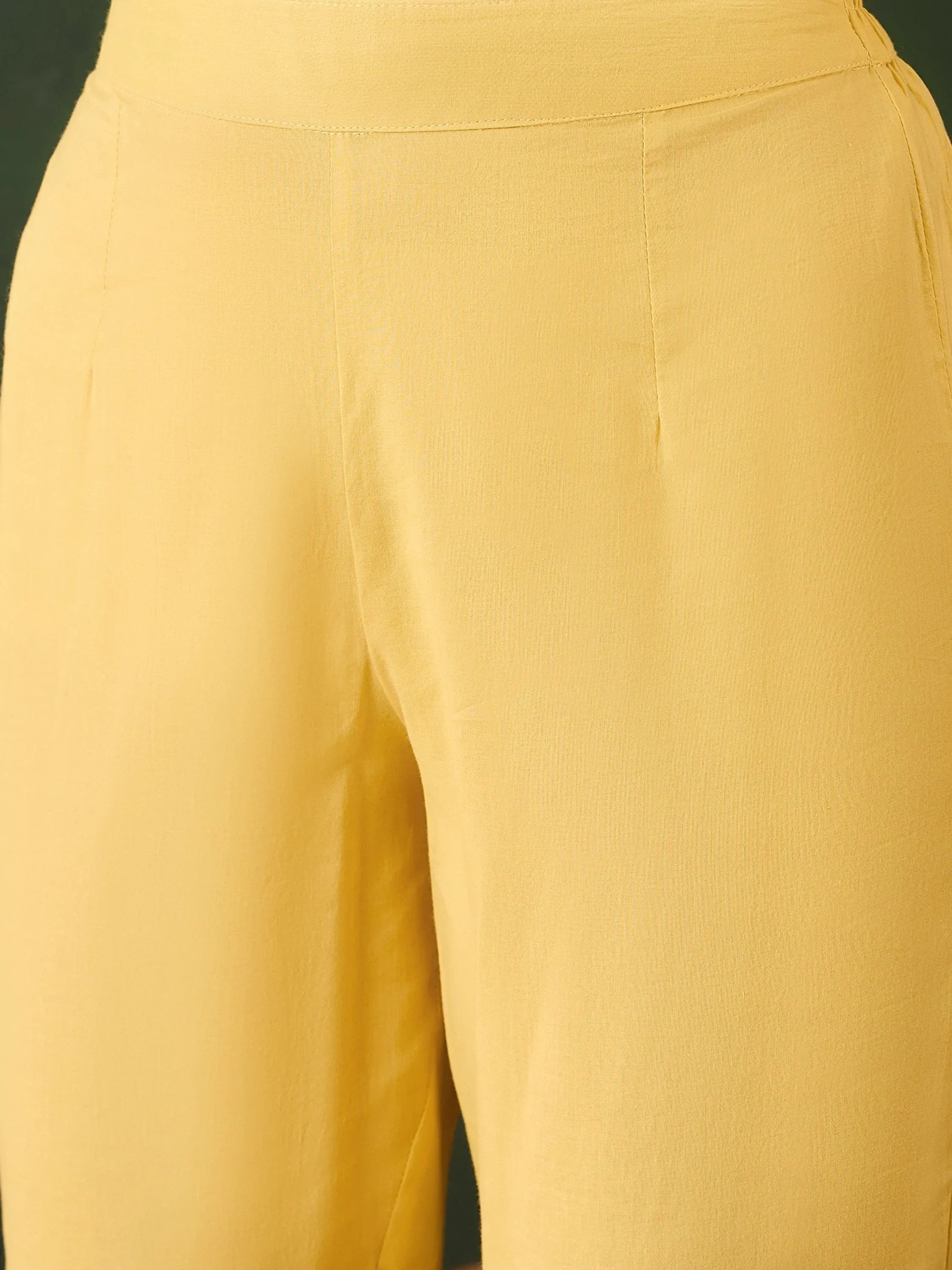 Close-up of yellow women's ethnic palazzo pants with high waist and soft fabric texture