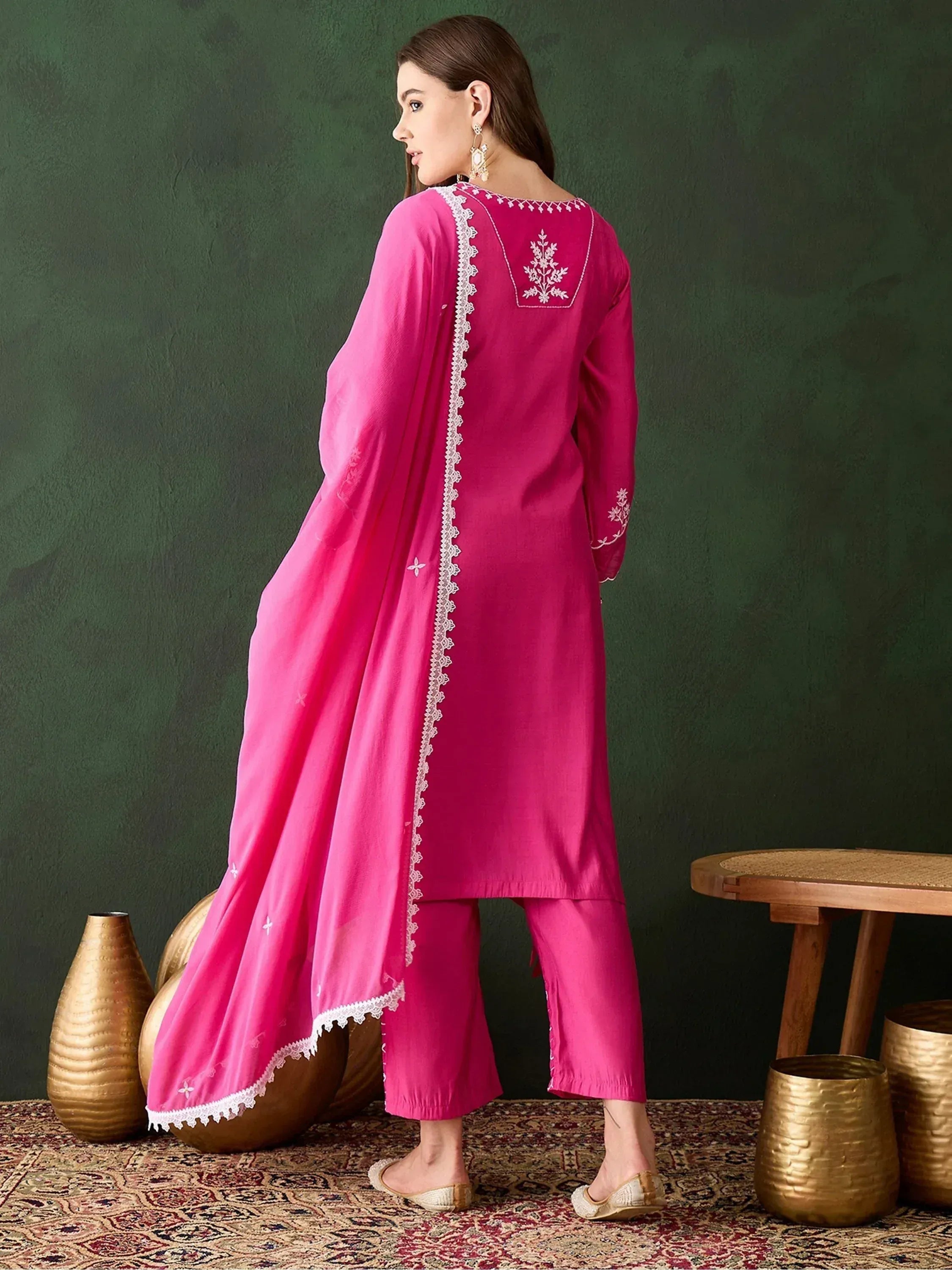 Pink embroidered salwar kameez with lace detailing, perfect for ethnic occasions