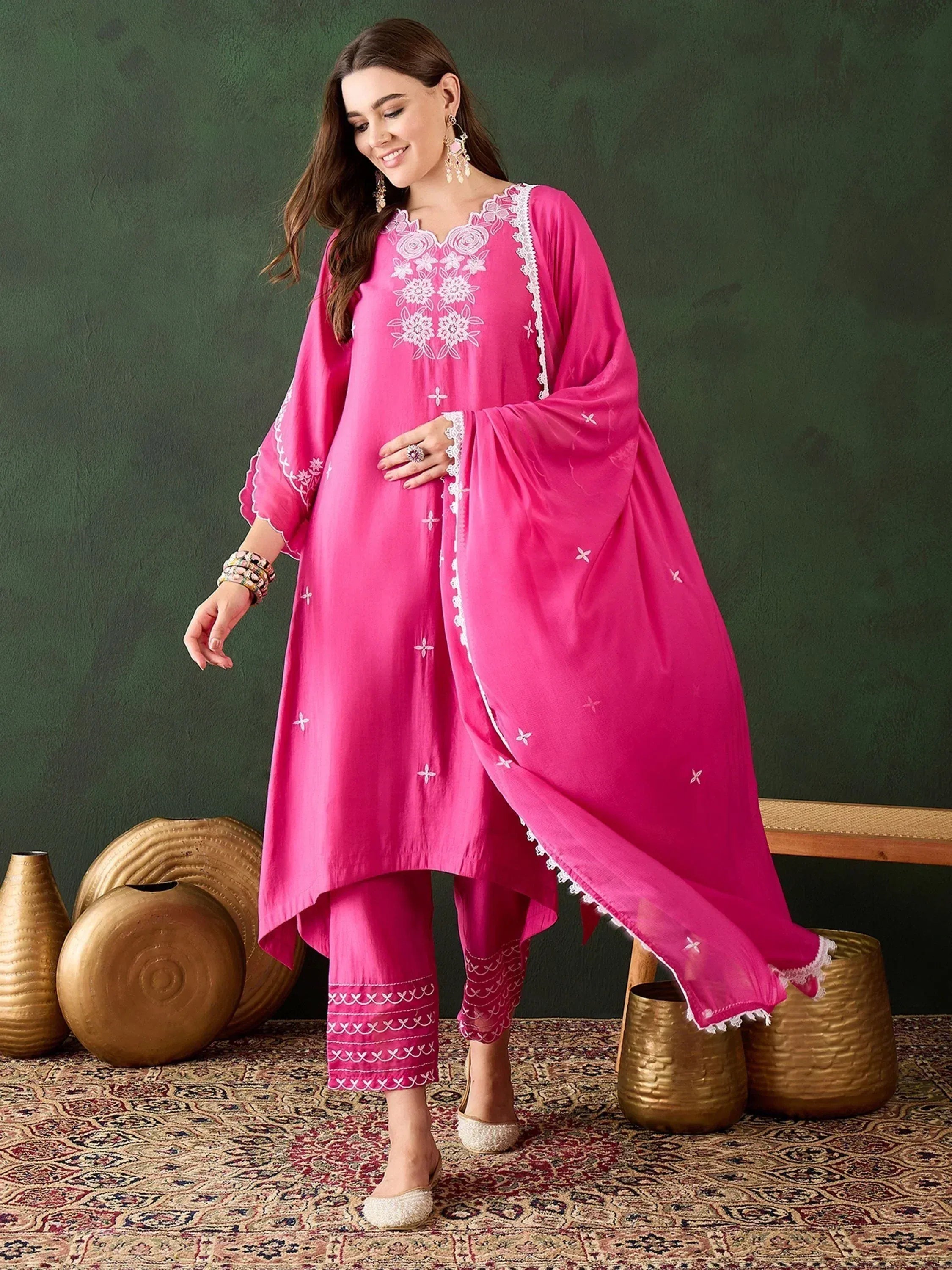 Pink embroidered salwar kameez with floral detailing and matching dupatta for ethnic wear