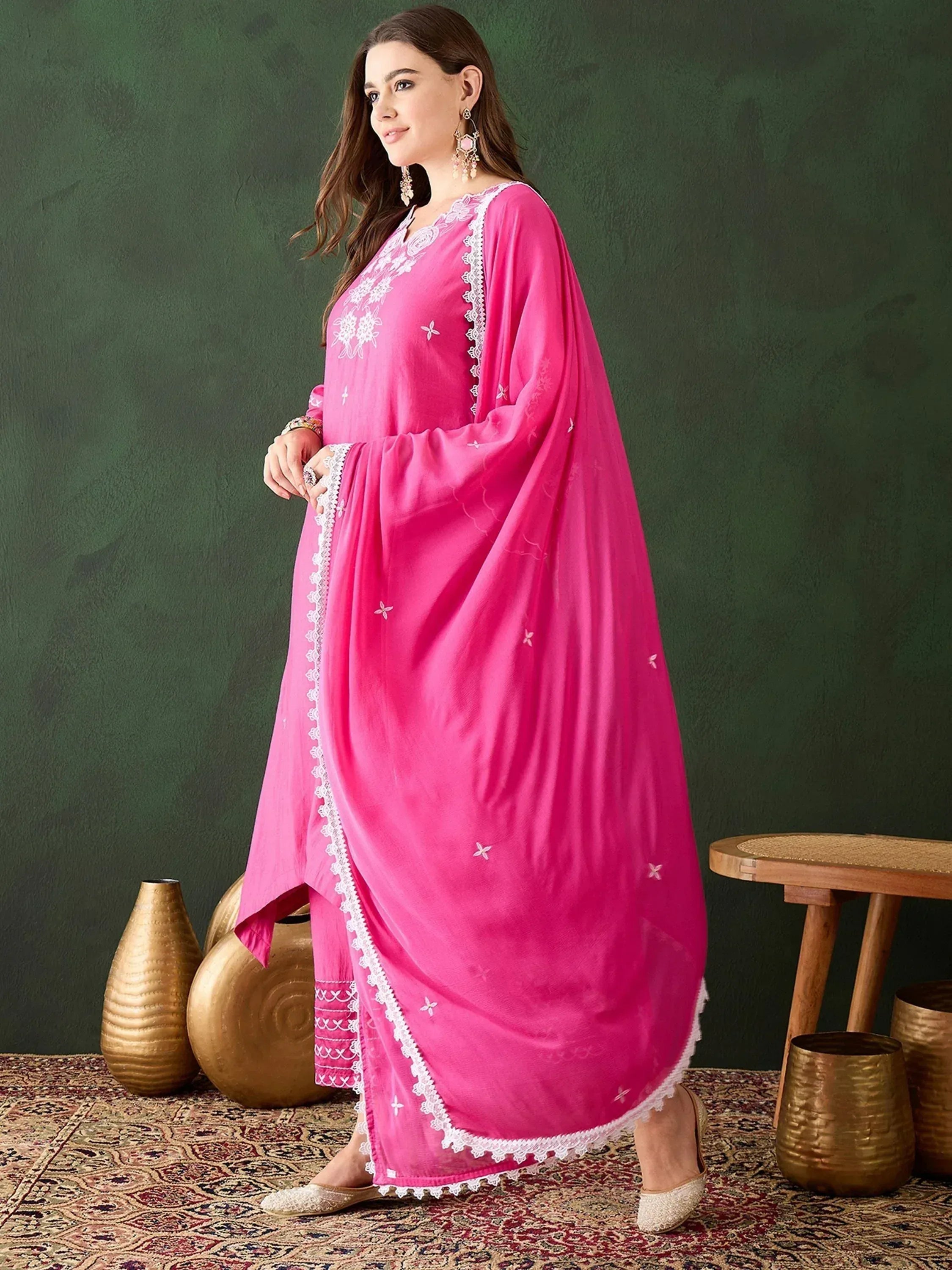 Pink embroidered ethnic gown with white lace detailing, perfect for Indian festive wear