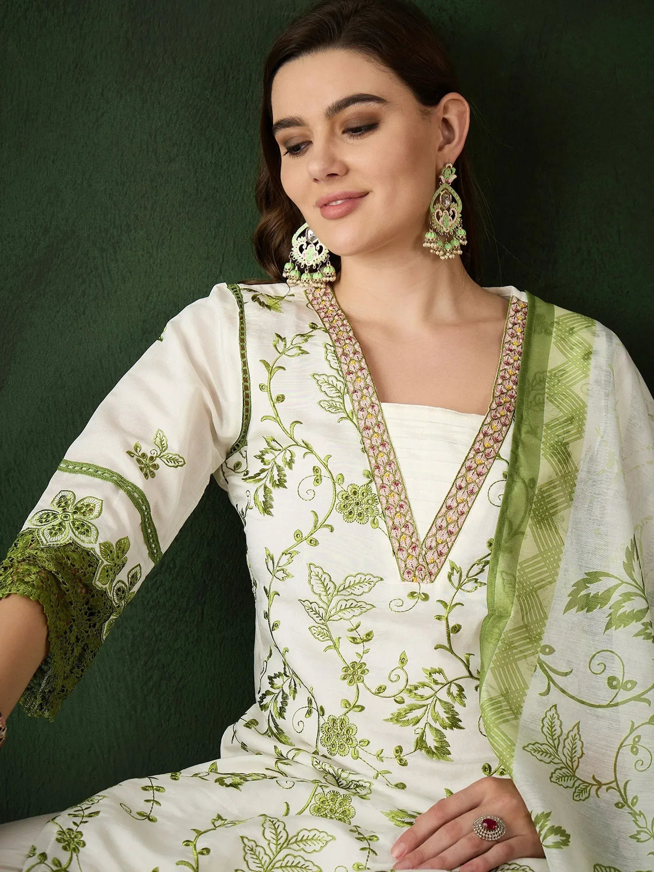 White and green embroidered salwar kameez with floral design and matching dupatta, ideal for ethnic wear
