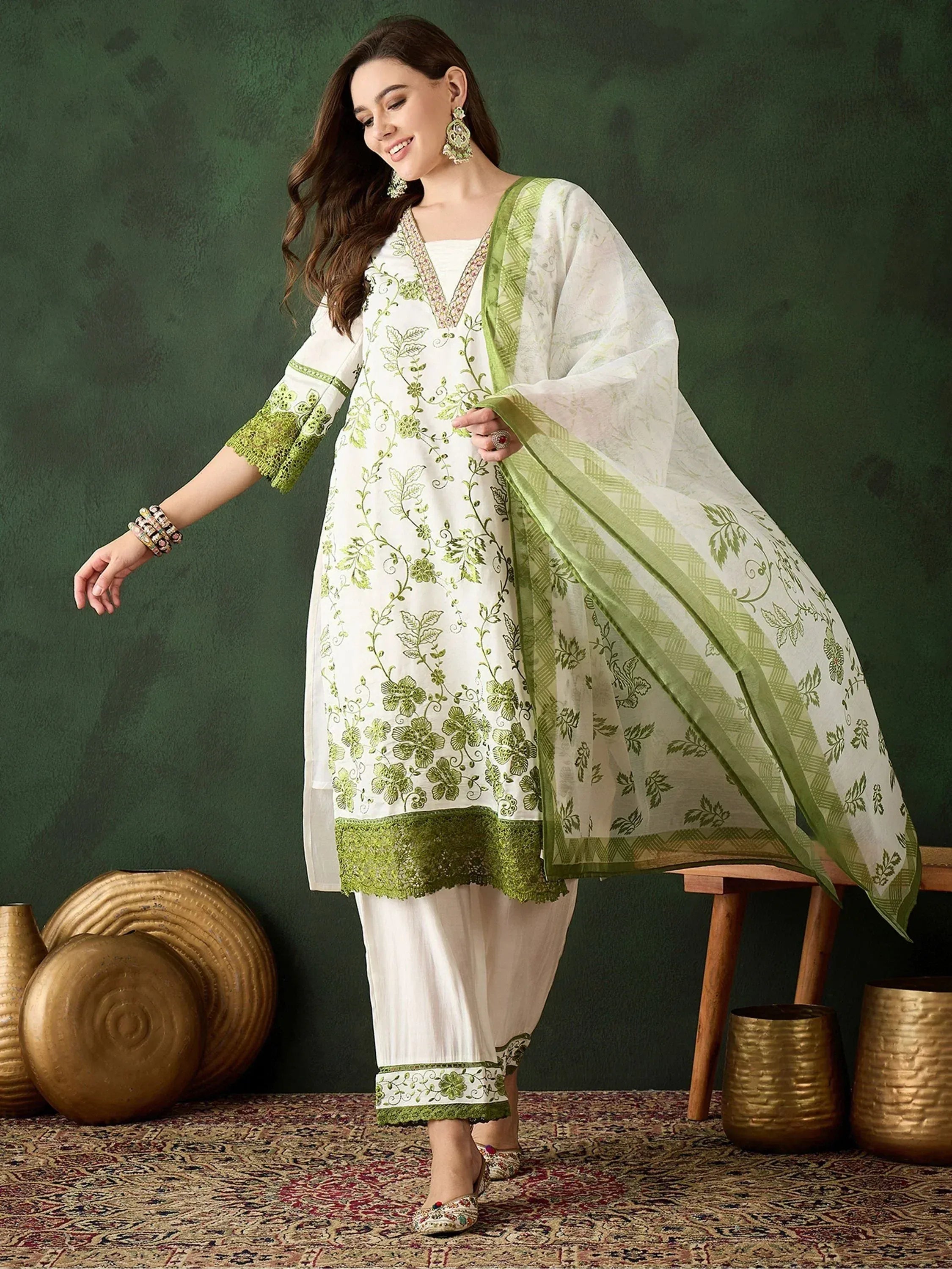 White and green embroidered salwar kameez with floral design, perfect for ethnic wear occasions