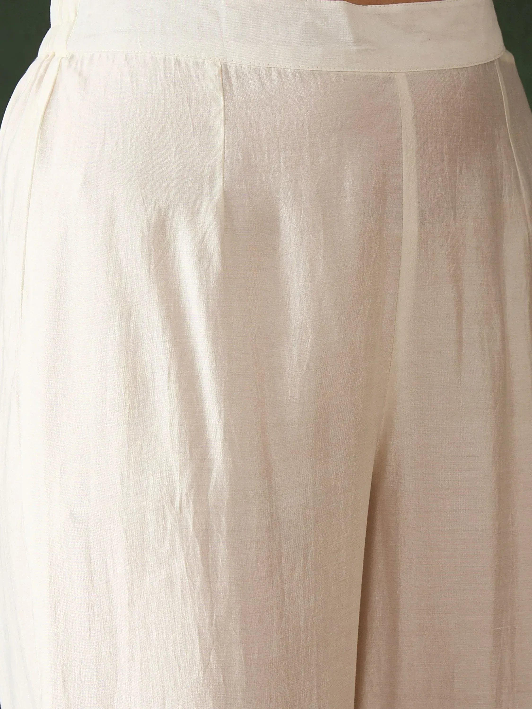 Cream ethnic palazzo pants with high waist and pleated design, ideal for salwar kameez or fusion wear
