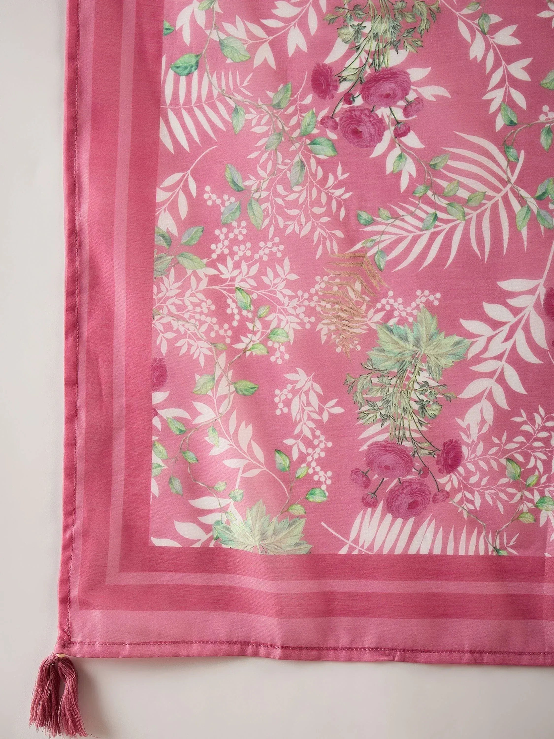 Pink floral dupatta with green leaves, white patterns, and tassels for ethnic wear