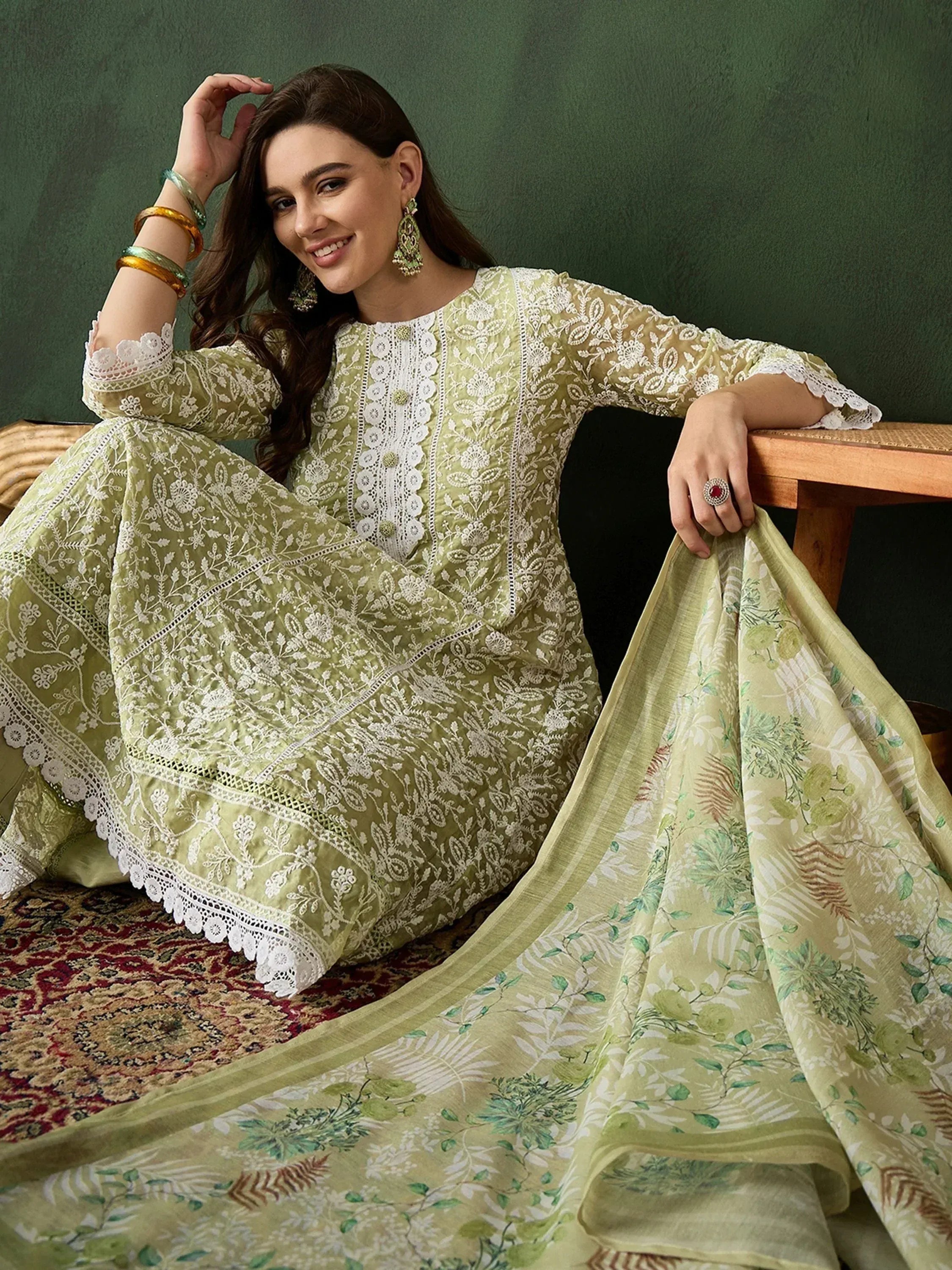 Elegant green embroidered salwar kameez with floral dupatta, perfect for Indian ethnic wear occasions.