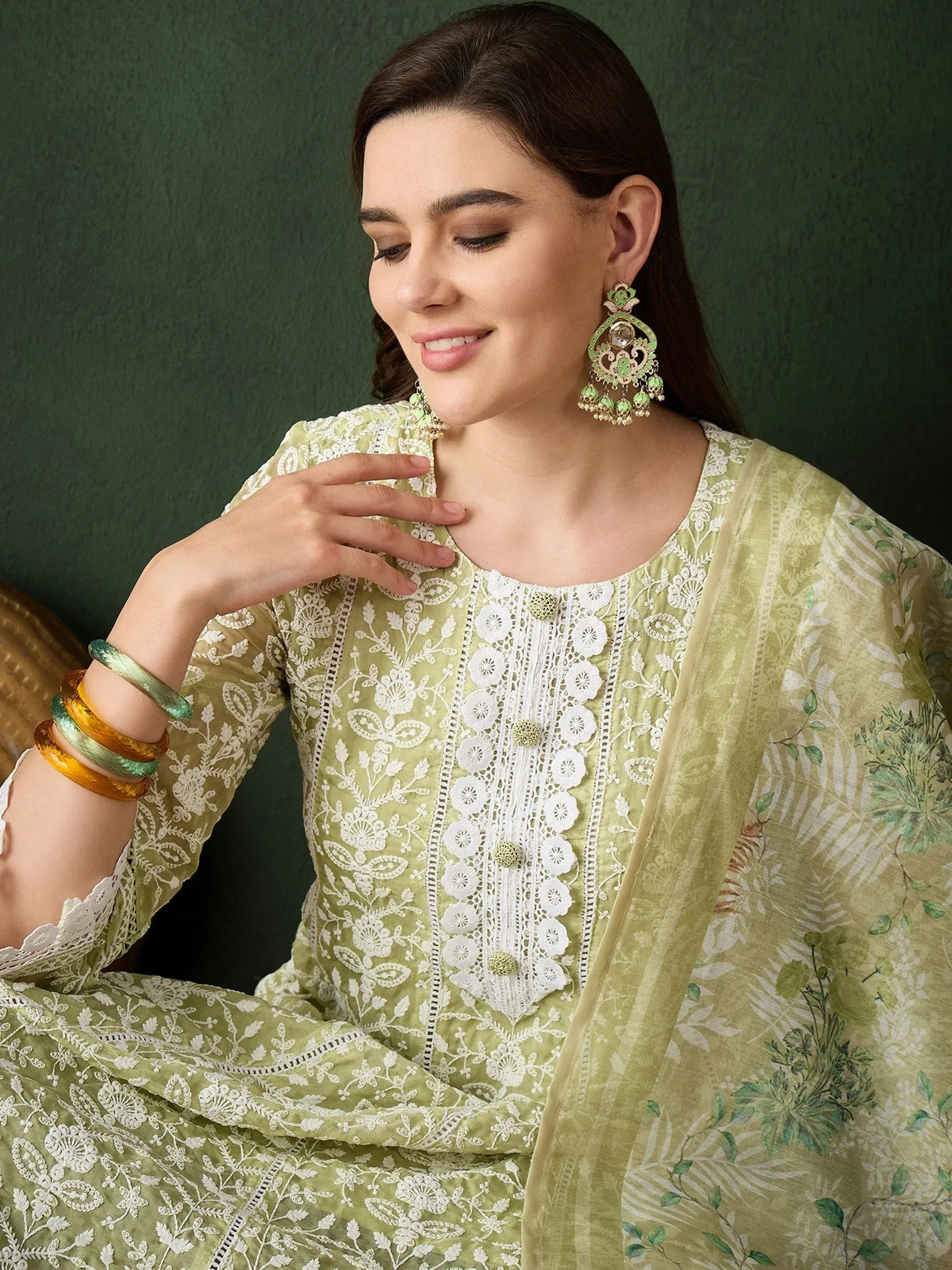 Elegant green embroidered salwar kameez with floral dupatta, perfect for Indian ethnic wear occasions.