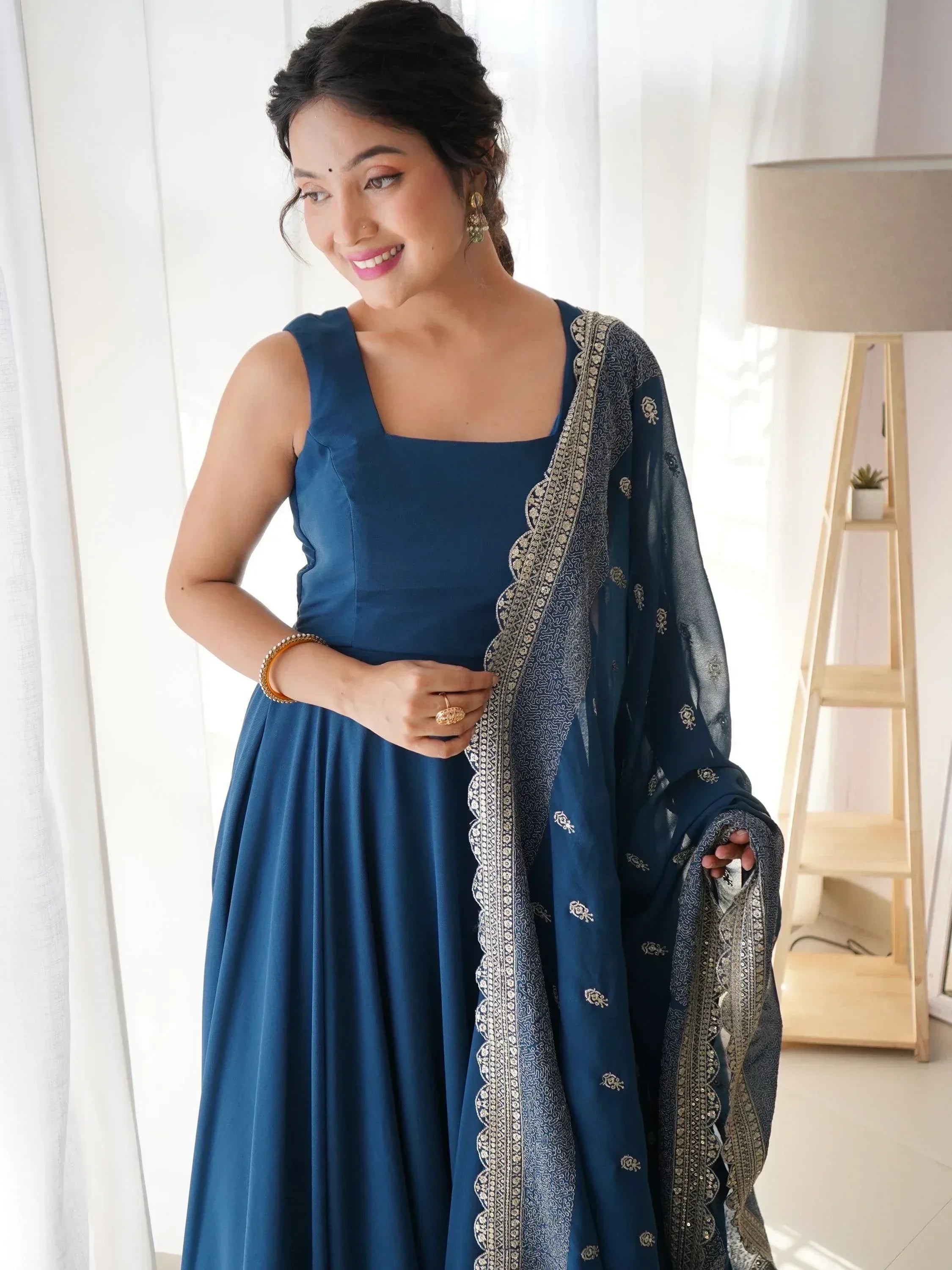 Blue ethnic gown with embroidered dupatta, perfect for Indian occasions and festive wear